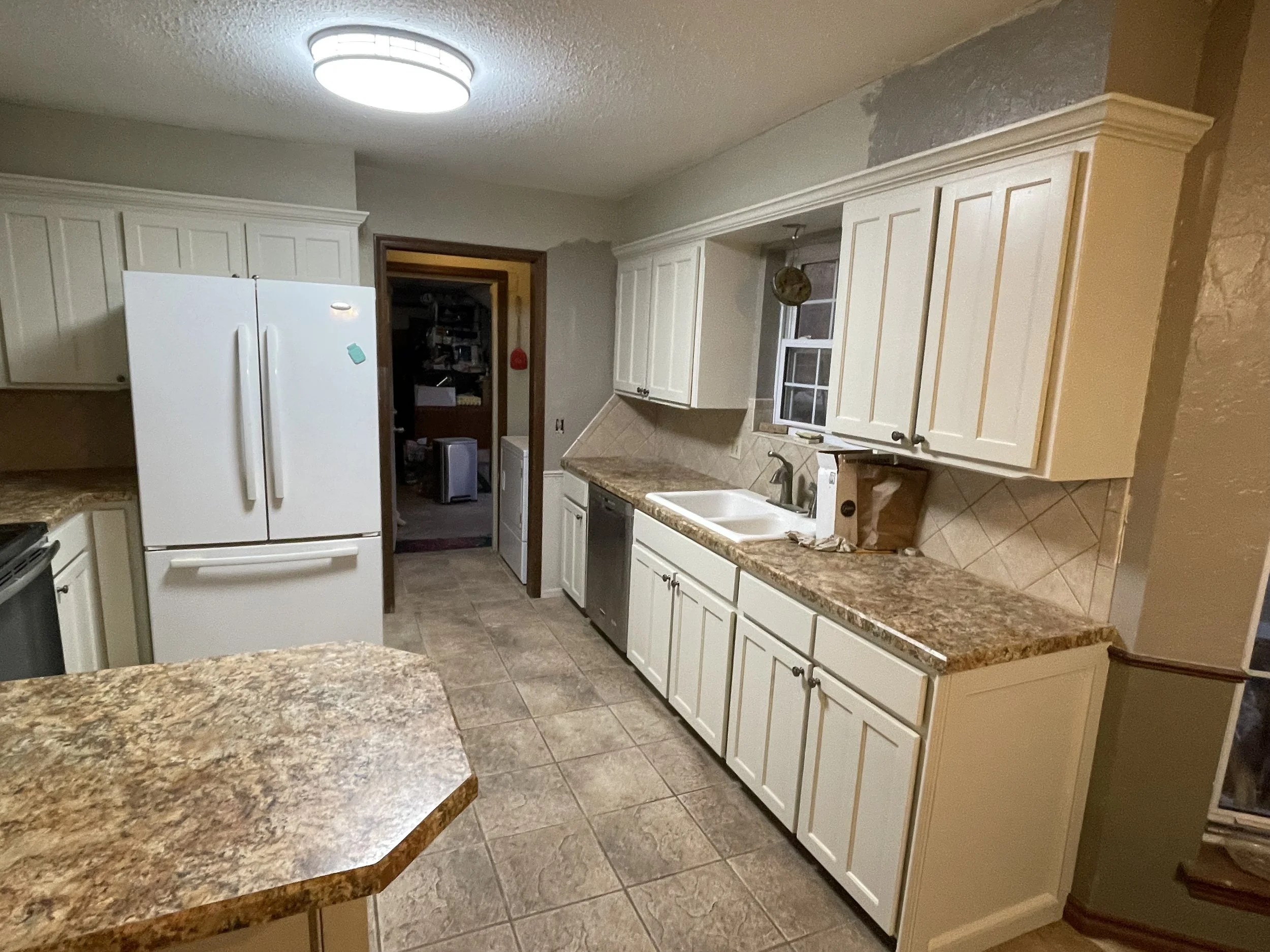 Kitchen cabinet paint in Midwest City, OK. Kitchen cabinet painted cream.