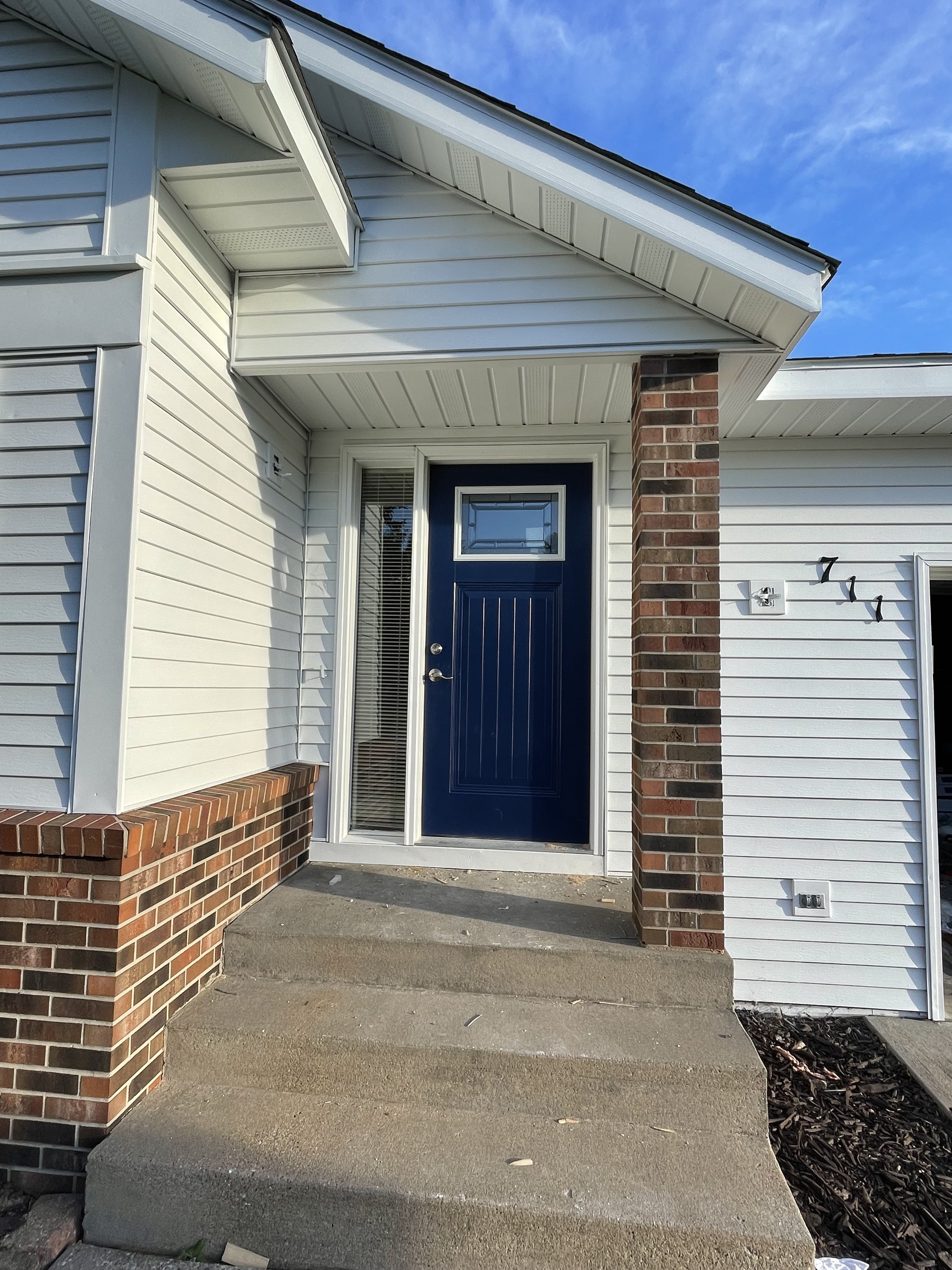 Front door paint in Oklahoma. Front door painted deep blue.