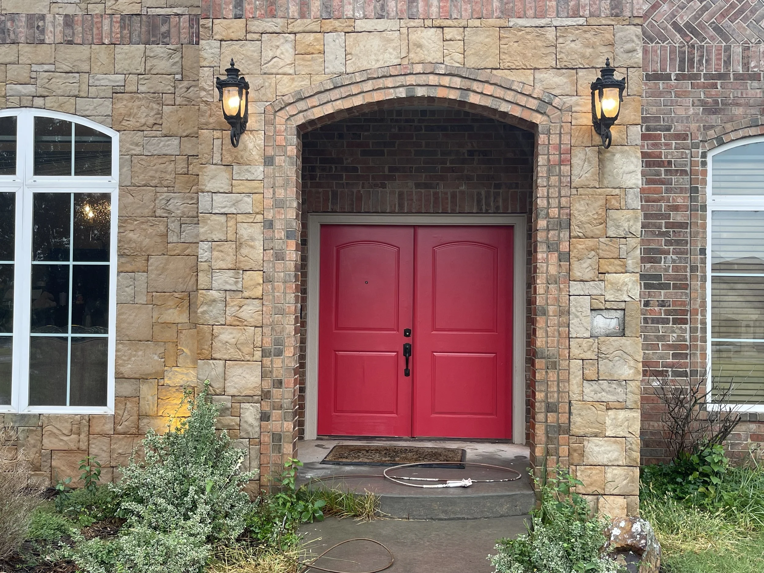 Front door paint in Oklahoma City, OK. Front door painted deep red.