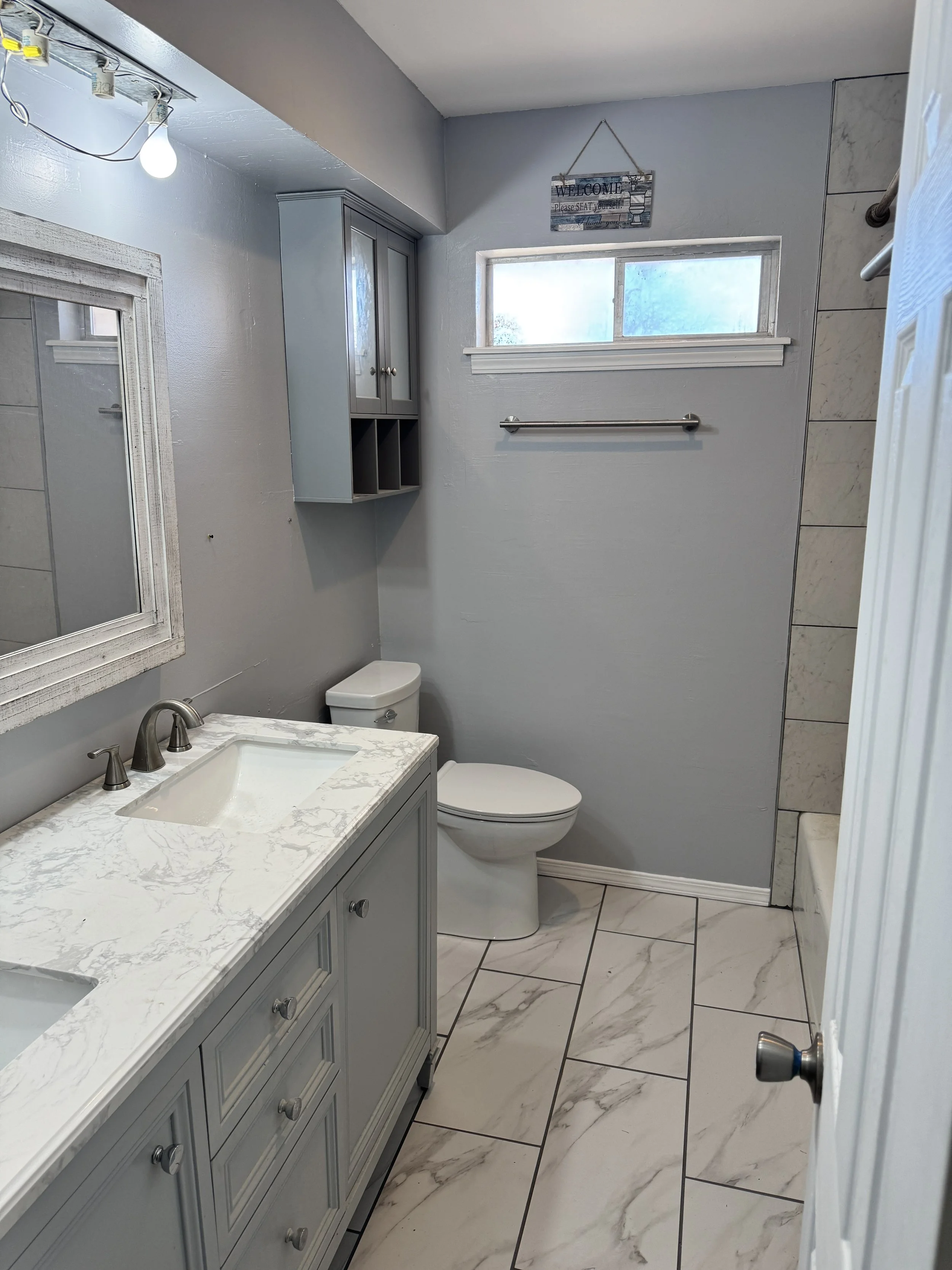 Bathroom remodel in Oklahoma City, tile installation, vanity installation, toilet installation, walls painted.