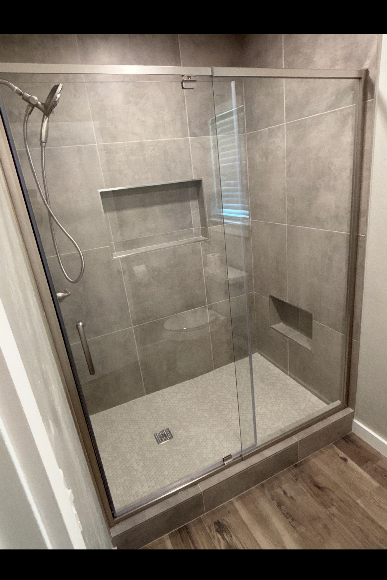 Custom tile shower in Choctaw, OK. Custom shower, shower pan, shower niche installation, Glass door installation, and custom walk in shower installation. 