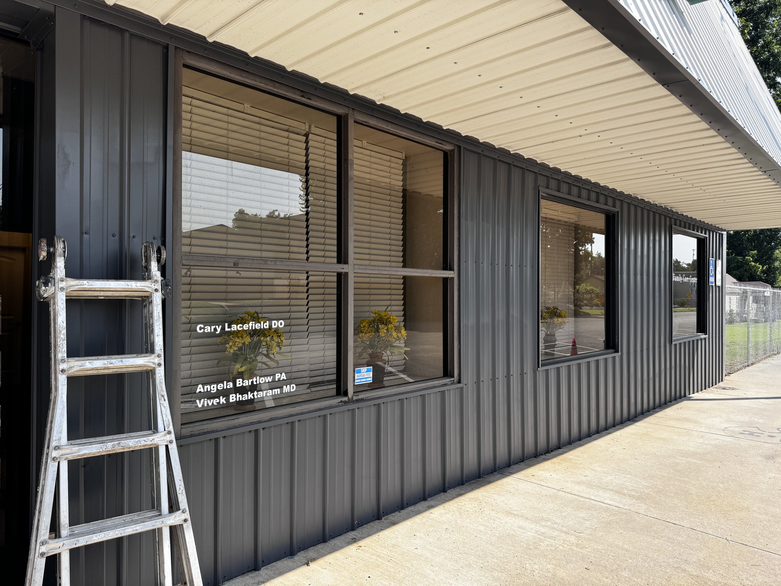 Commercial exterior paint in Harrah, OK. Exterior building painted gray and cream.