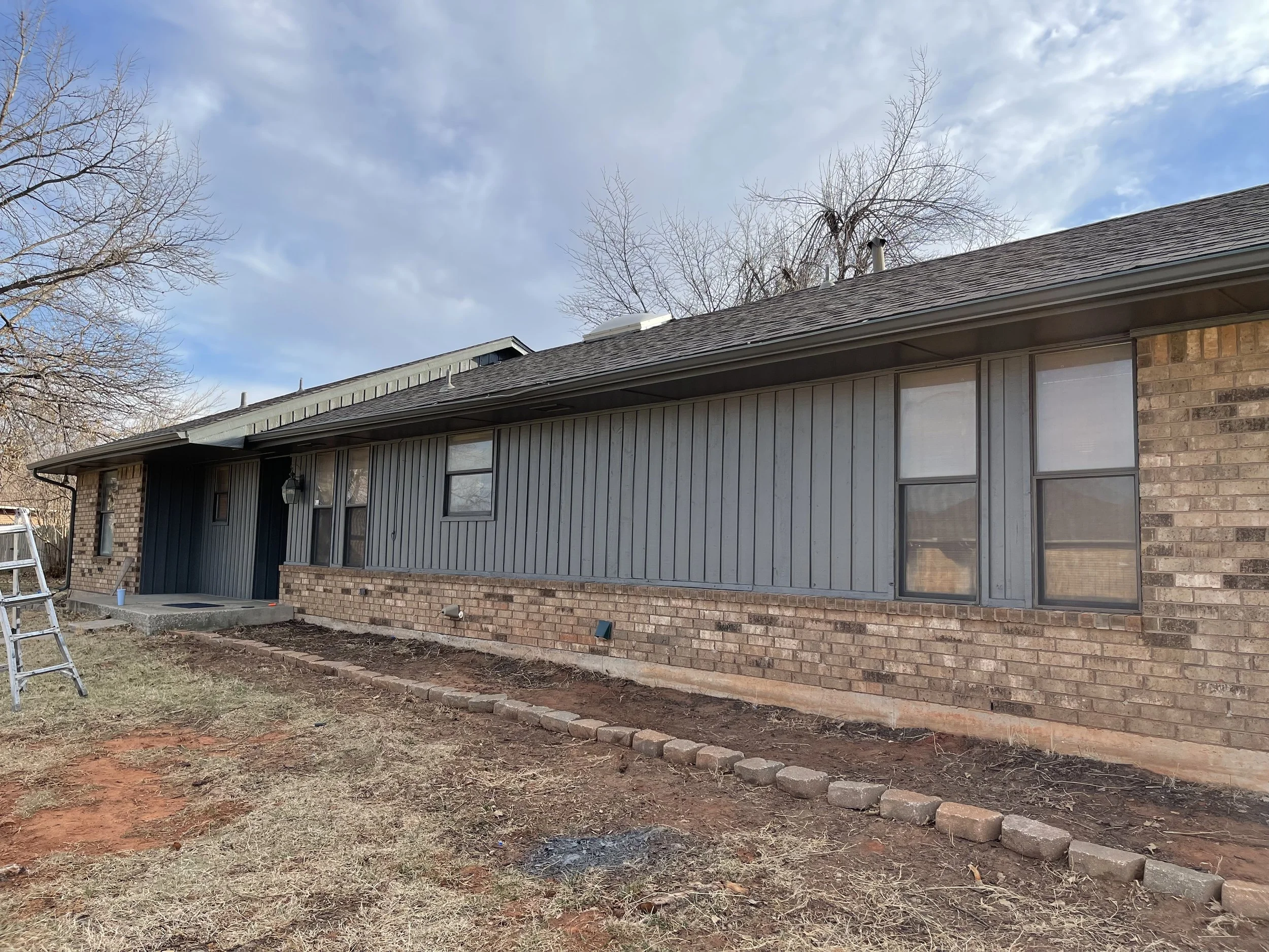 Exterior house painting in Oklahoma City, OK Exterior house painted gray 