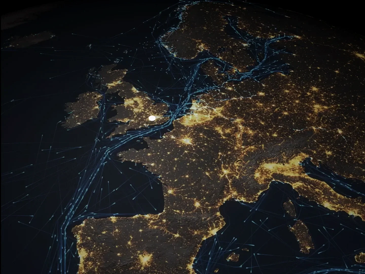 Satellite view of Europe at night showing city lights and digital network connections over land and water.