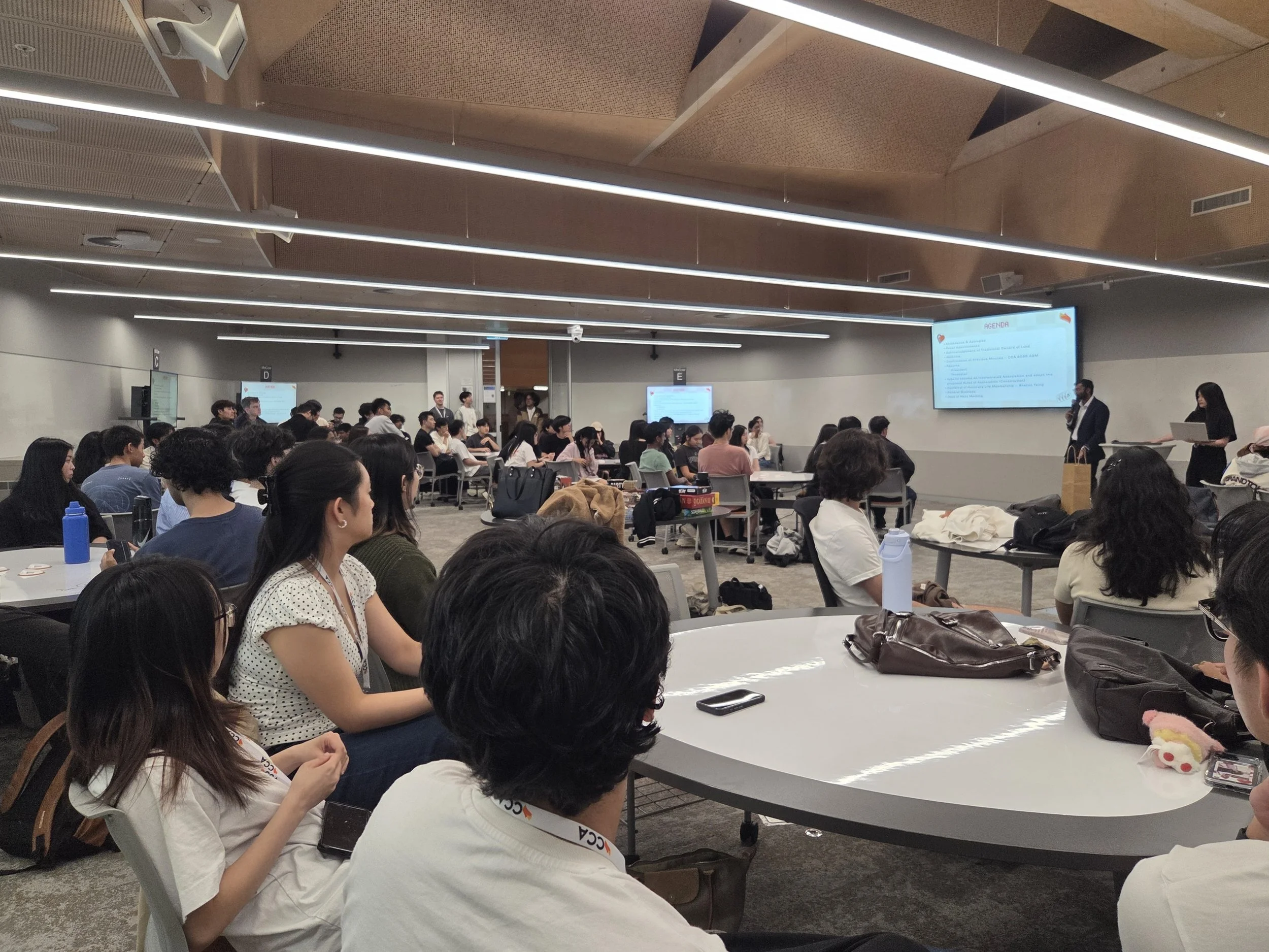 CCA 2026 sem 1 OGM: students listening to the speaker