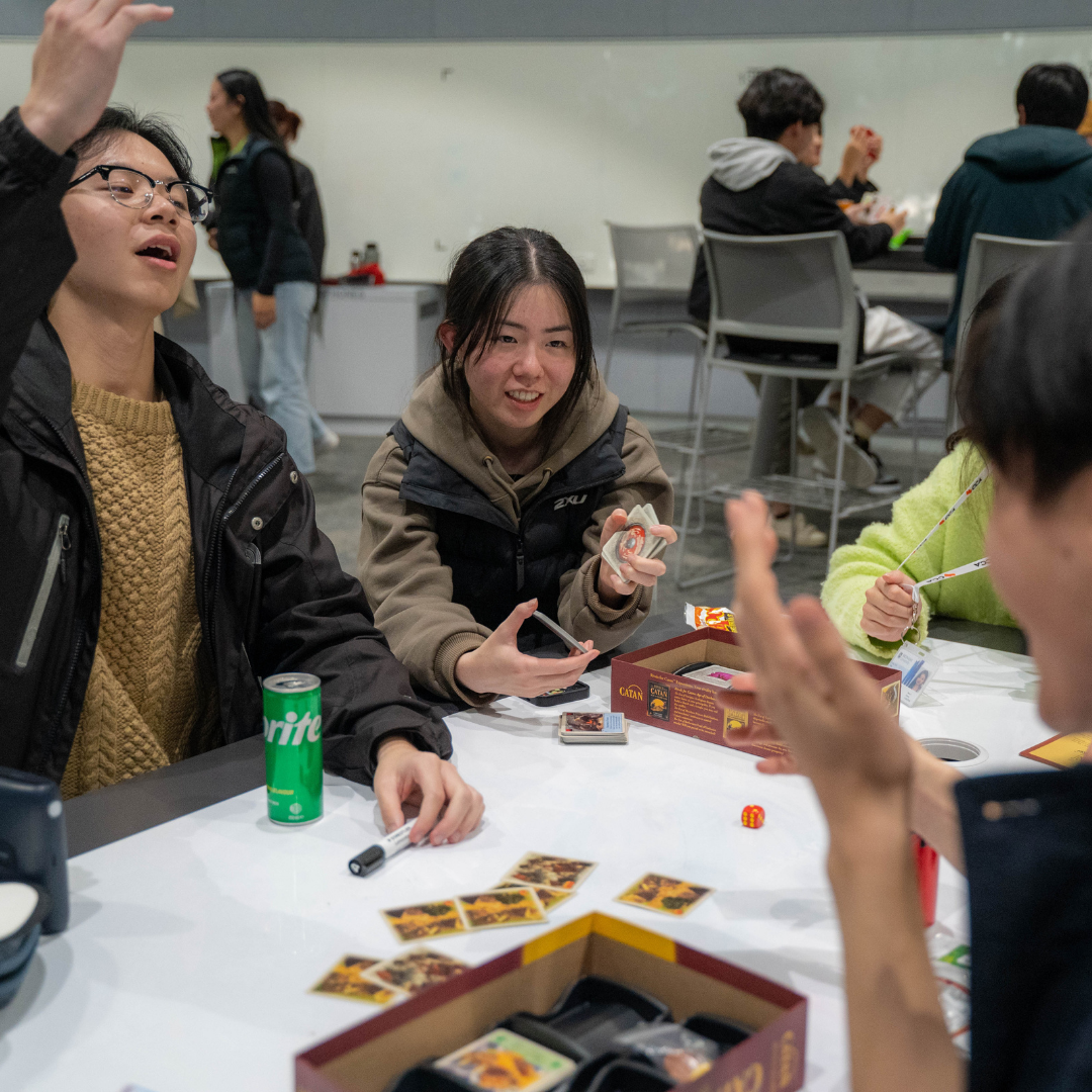 CCA 2023 Games Night: Students playing with cards