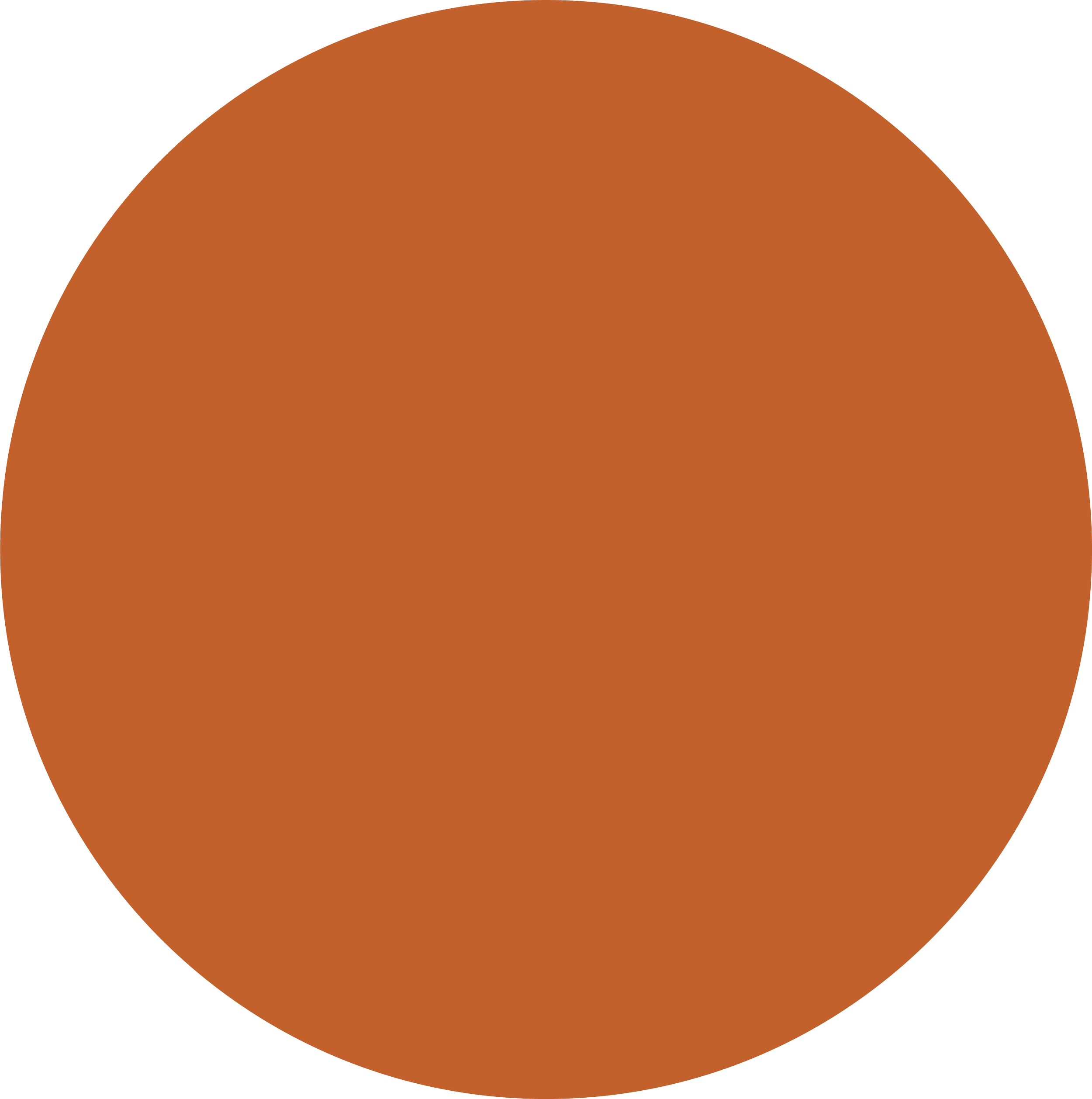 A close-up view of a geometrical pattern with a large, semi-circular shape in a reddish-brown color on a black background.