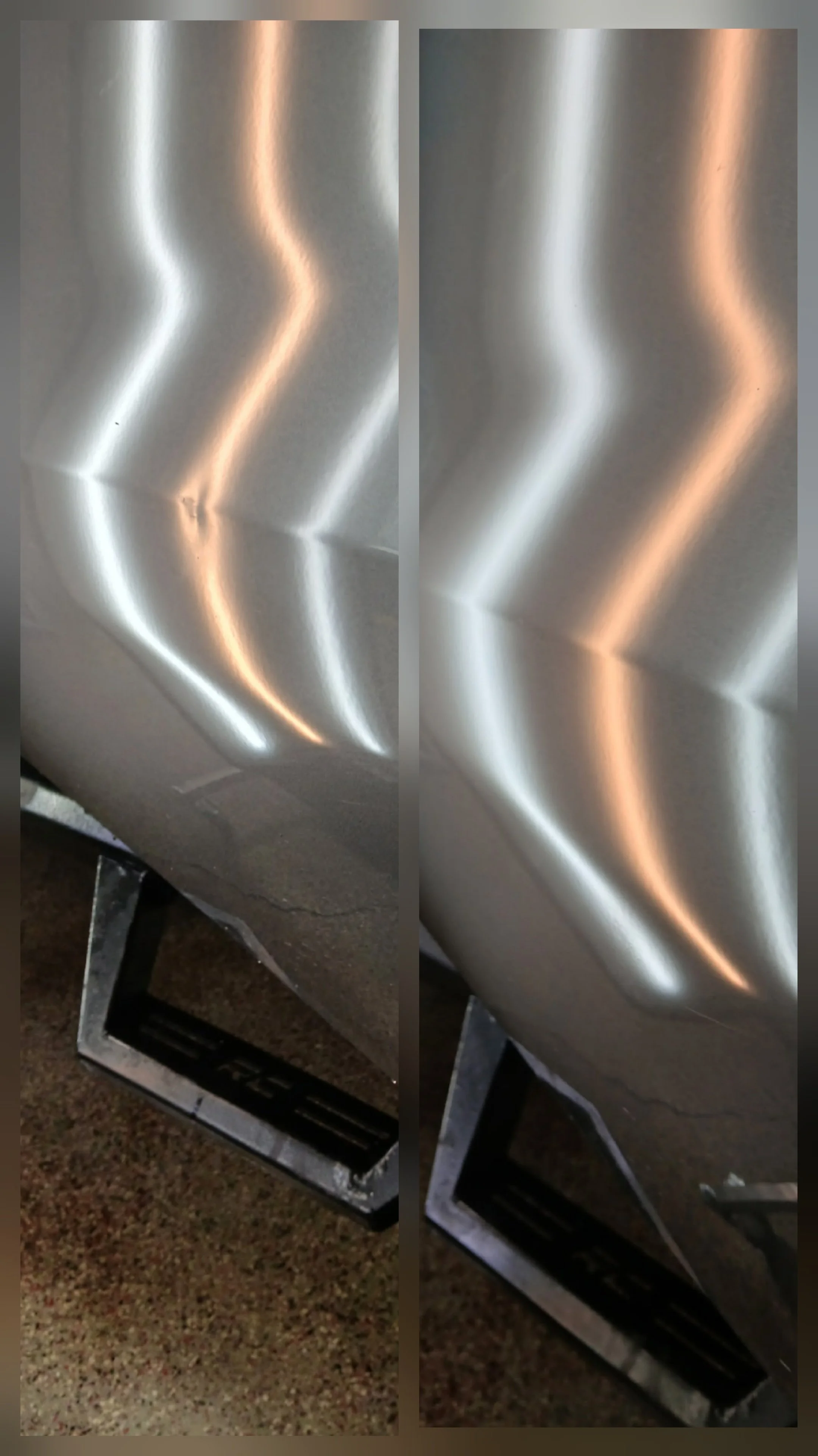Close-up view of shiny metallic surface with curved light reflections, beneath a metallic frame or stand.