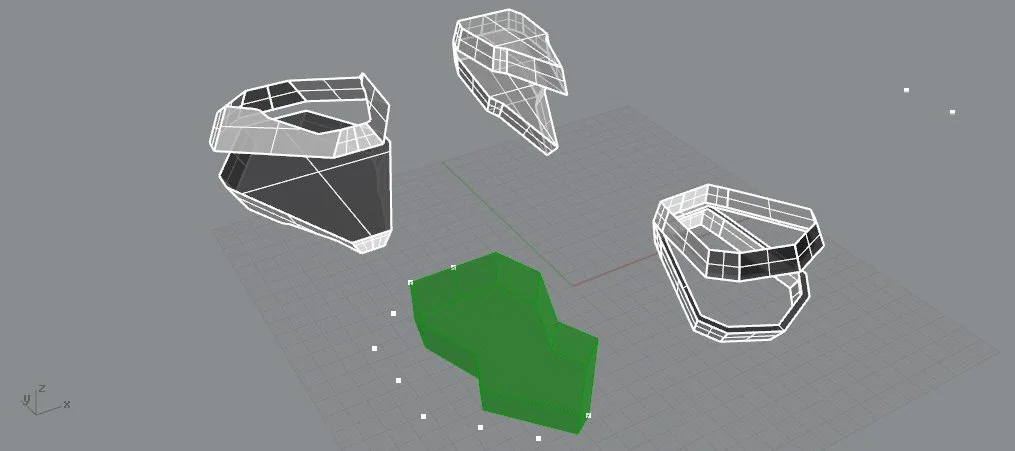 3D wireframe model of removable helmet parts and a green helmet faceplate on a gray background