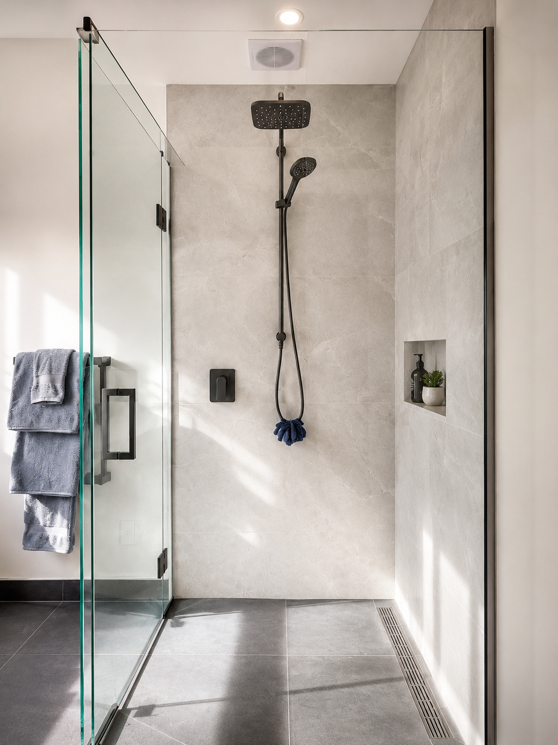 Modern tiled shower with black fittings