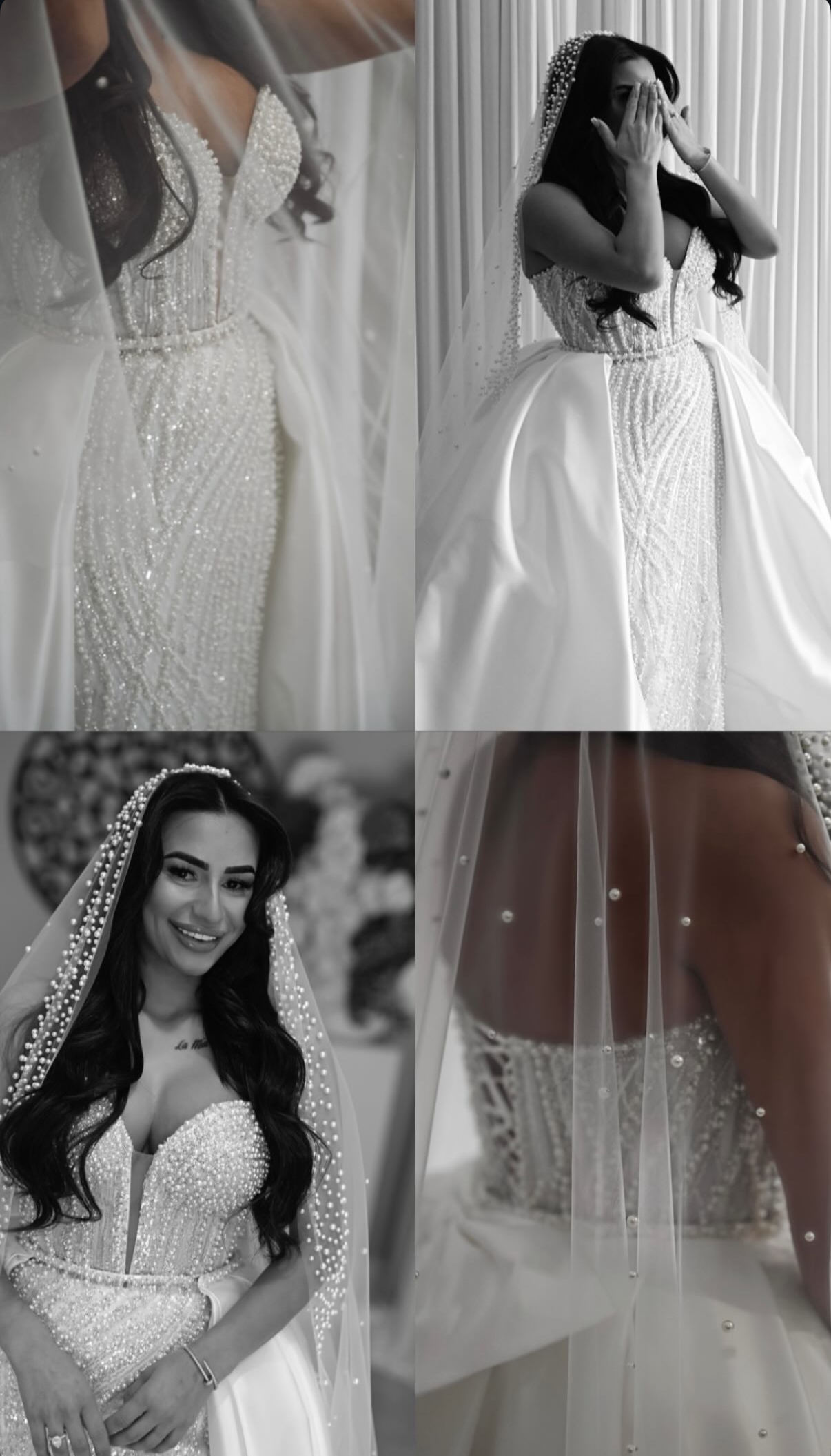 A bride with long dark hair, wearing a white wedding gown with pearl embellishments and a veil adorned with pearls, posing inside against a curtain background.