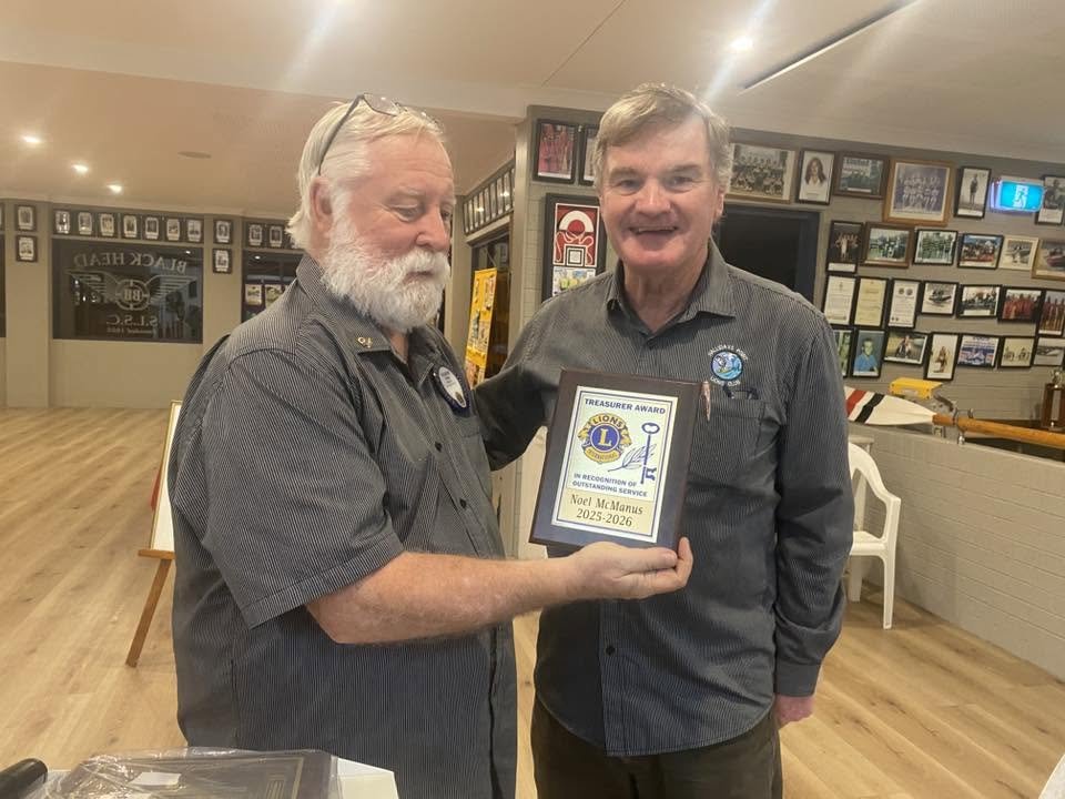 President Vaughn presents the Treasurer's Award to Noel McManus