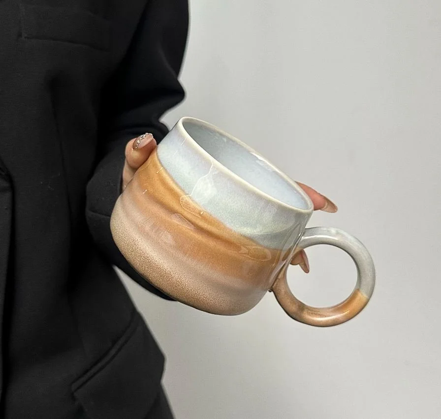Handmade ceramic mountain mugs with earthy gradient glaze and rounded handles, perfect for cosy coffee moments and minimalist home café aesthetics.