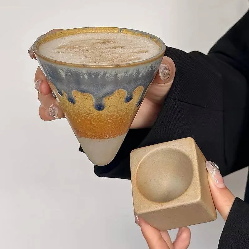 Handmade inverted mountain ceramic coffee mug with earthy drip glaze and sculptural wooden-style base, perfect for lattes, matcha and cosy café aesthetics.