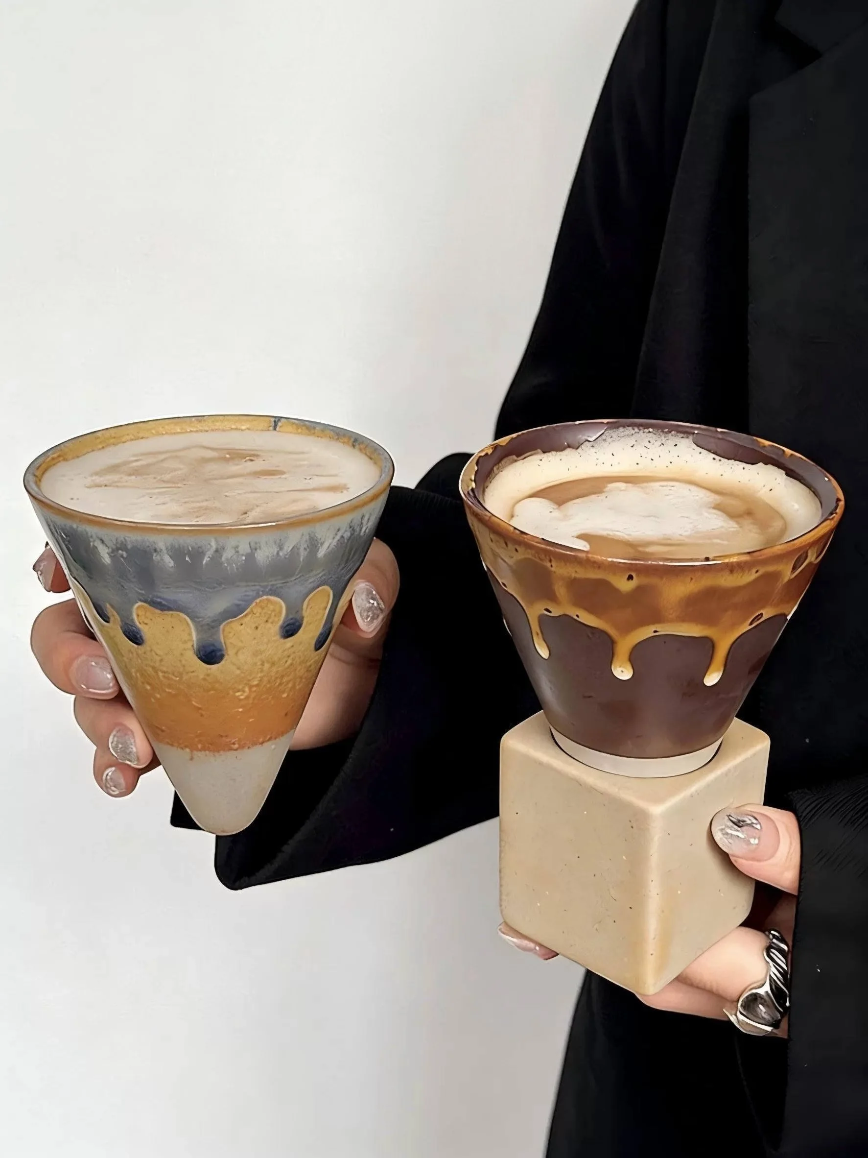 Handmade inverted mountain ceramic coffee mug with earthy drip glaze and sculptural wooden-style base, perfect for lattes, matcha and cosy café aesthetics.