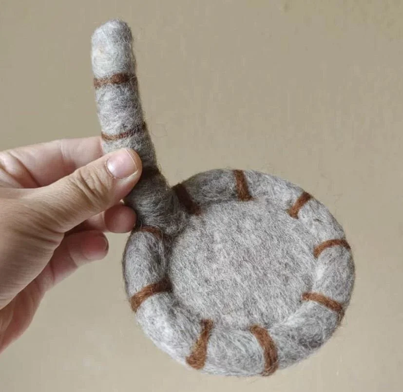 Cute handmade cat tail wool coasters with playful striped felt design, perfect for cosy coffee mugs, kawaii desk décor and aesthetic home styling.
