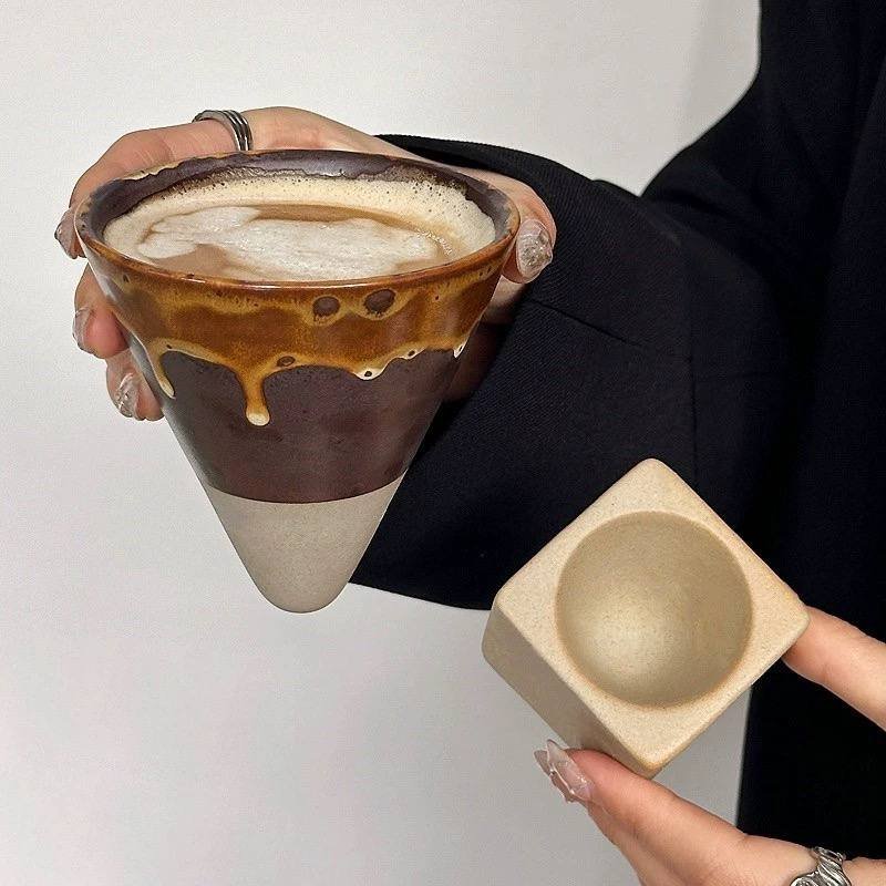 Handmade inverted mountain ceramic coffee mug with earthy drip glaze and sculptural wooden-style base, perfect for lattes, matcha and cosy café aesthetics.