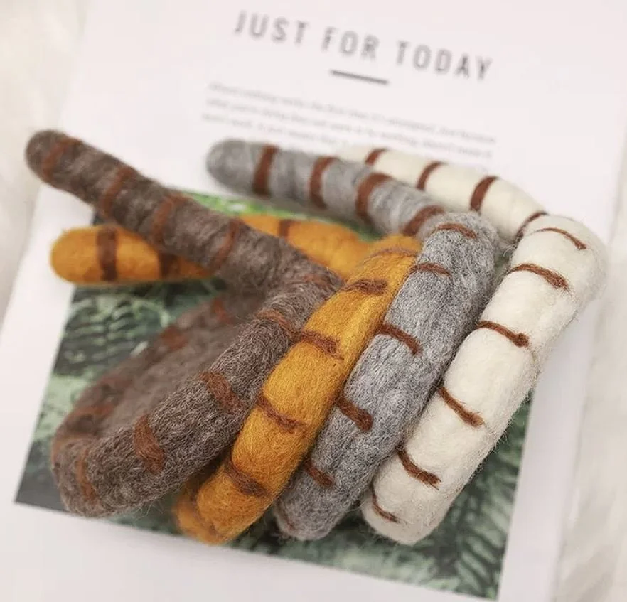 Cute handmade cat tail wool coasters with playful striped felt design, perfect for cosy coffee mugs, kawaii desk décor and aesthetic home styling.