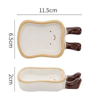 Cute toast-shaped ceramic snack plate with playful dangling boots, perfect for dipping sauces, desserts, jewellery trays and cosy kawaii table décor.