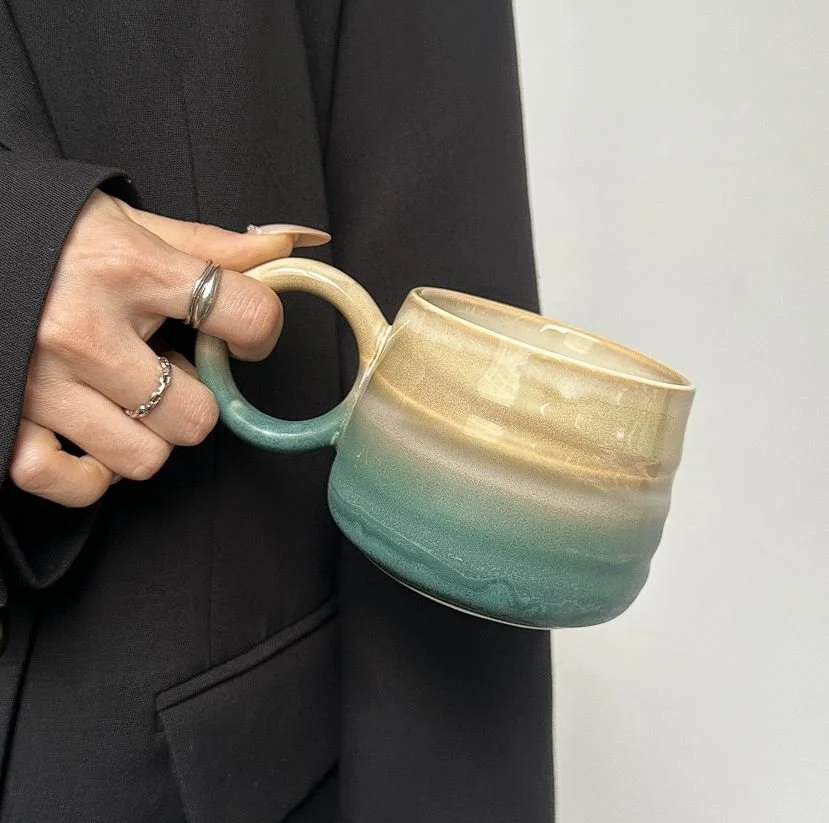 Handmade ceramic mountain mugs with earthy gradient glaze and rounded handles, perfect for cosy coffee moments and minimalist home café aesthetics.