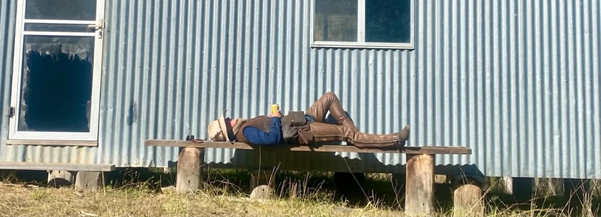 Kate Young getting horizontal after hours and days in the saddle on a packsaddling trip