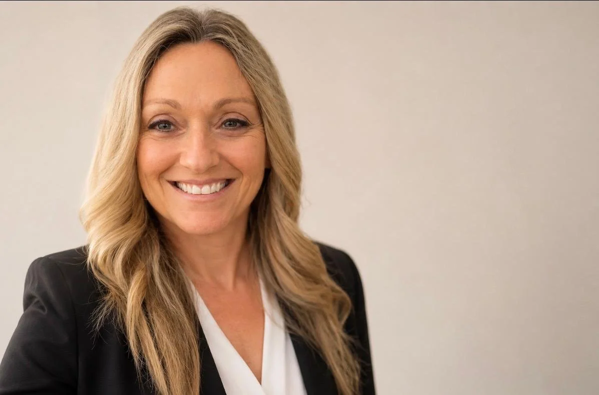 Tanya Levy, energy and stress management expert, smiling in a black blazer and white blouse.