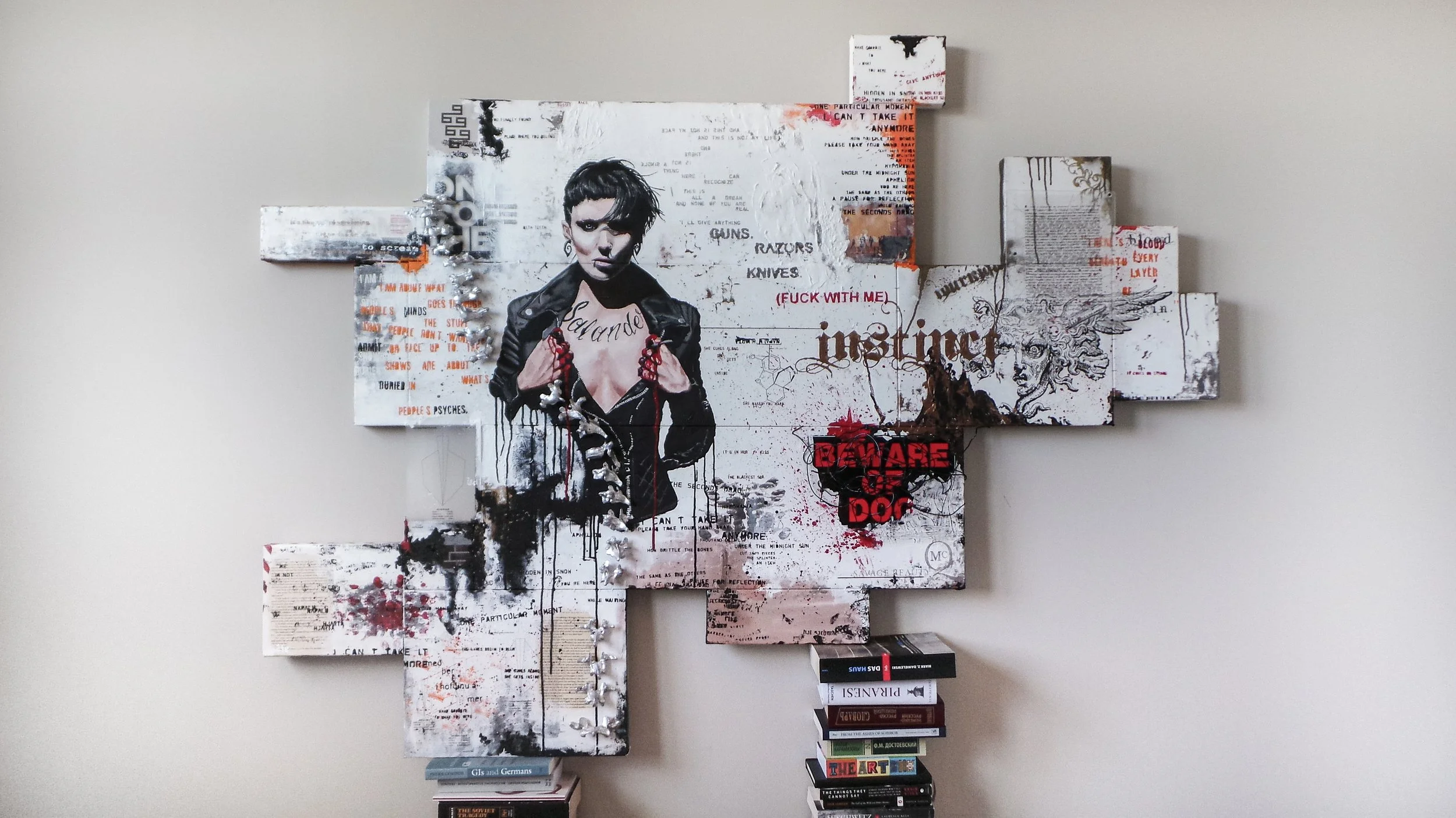 Mixed media Salander wall art featuring collage-style text and graphics.