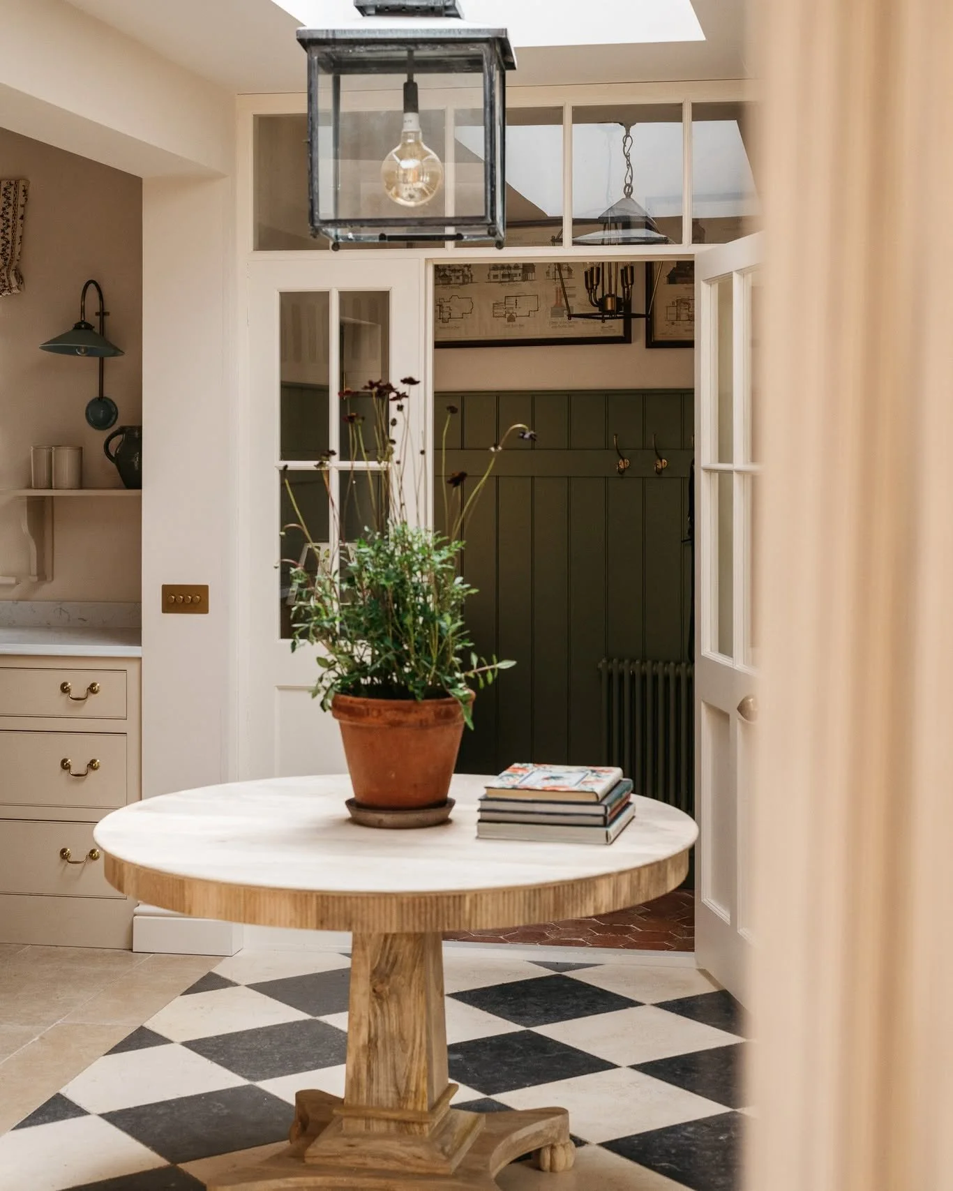 Creating a sense of arrival and flow was key in this open-plan space. Changes in floor finishes help to subtly distinguish each area without interrupting the overall feeling of openness.

#entrancehall #interiordesign #countryhouse #rennovation #inte