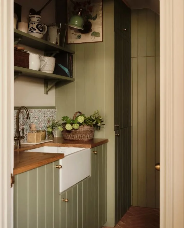 Our utility room in Richmond. We maximised the space by utilising the once redundant space under the stairs, that is great additional storage tucked underneath the staircase. We installed reclaimed terracotta tiles and T&amp;G panels to Howdens base 