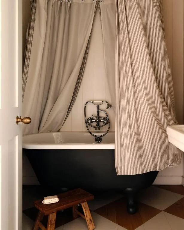 During our renovation we added a small bathroom off the newly formed first floor landing. Being small, we installed a traditional free standing bath, to give the illusion of more floor space, with a ceiling mounted shower &amp; curtain, to keep the r