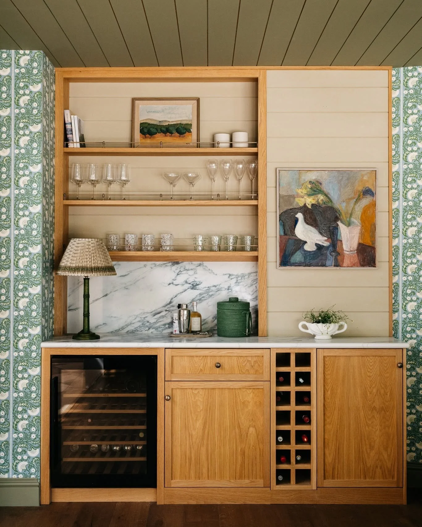 We created this bespoke bar within the Dining Room, positioned along the wall of the existing garage. Due to the angle of the wall, we used the design to create the illusion of a straighter, more linear elevation, while making clever use of the addit