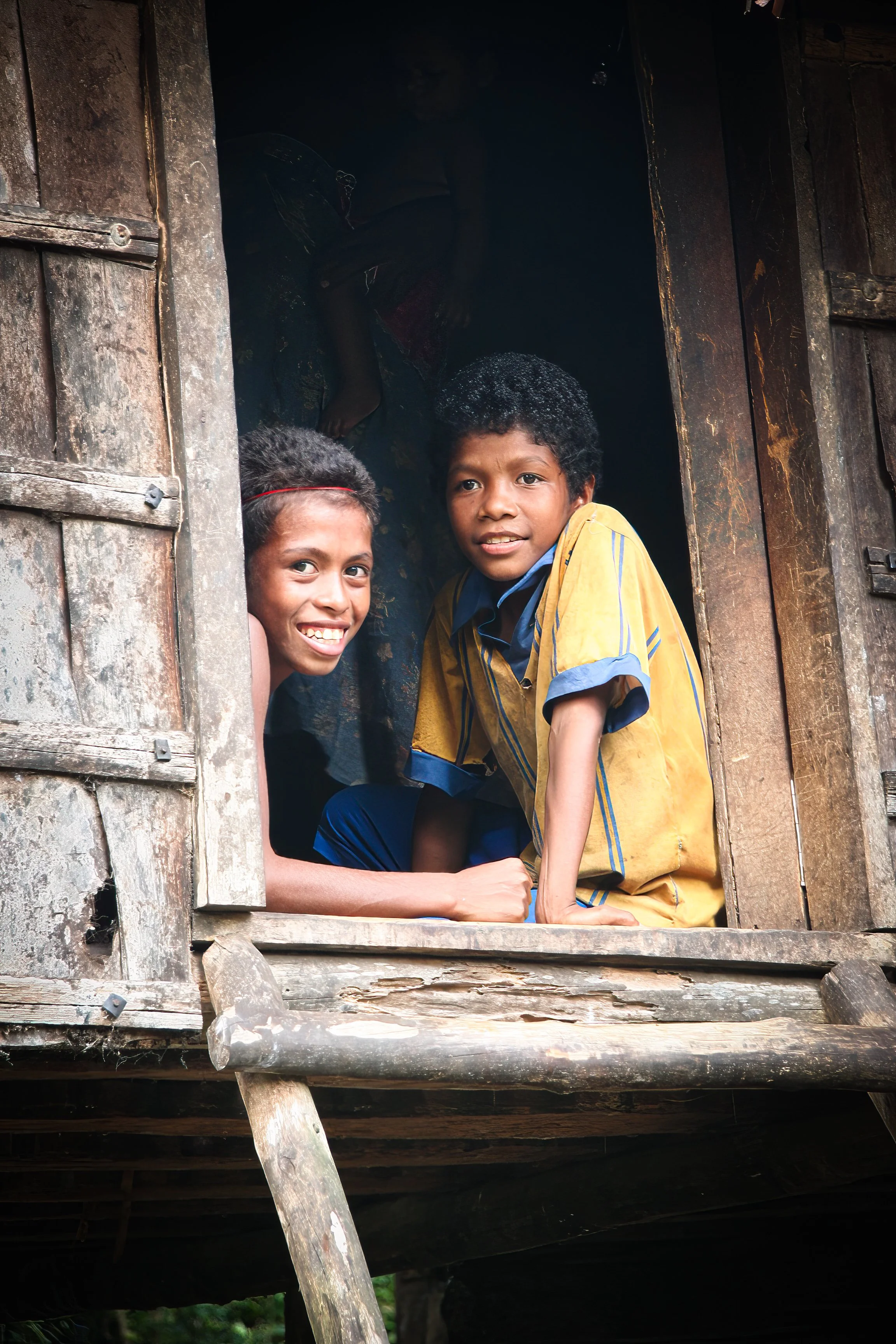 Local boys at Ebola Island, Louisiade Archipelago, Milne Bay Province, Papua New Guinea. 