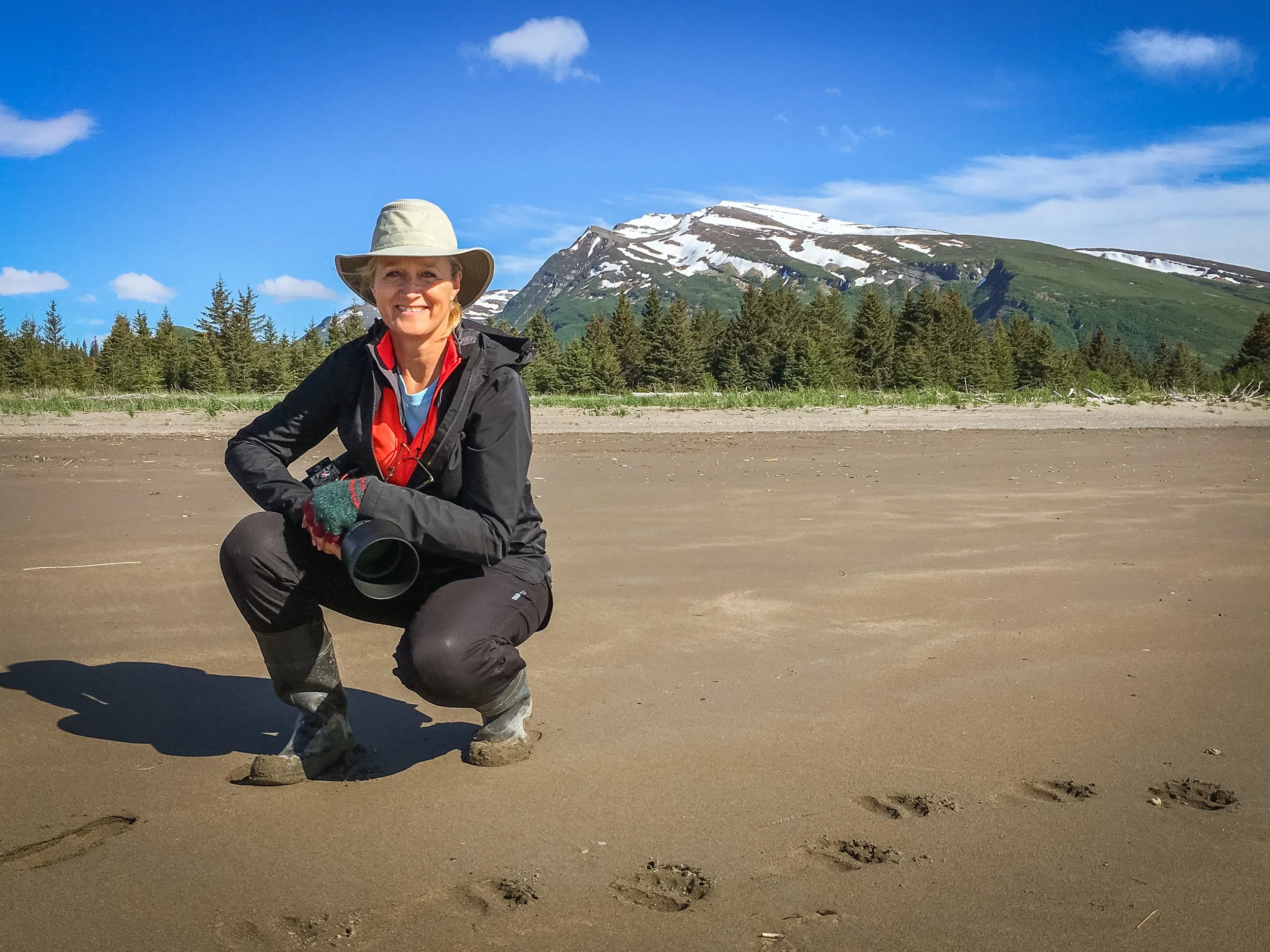 Photographer Linda Berry (Fox) on location on the beach of the Cook Inlet in Alaska.