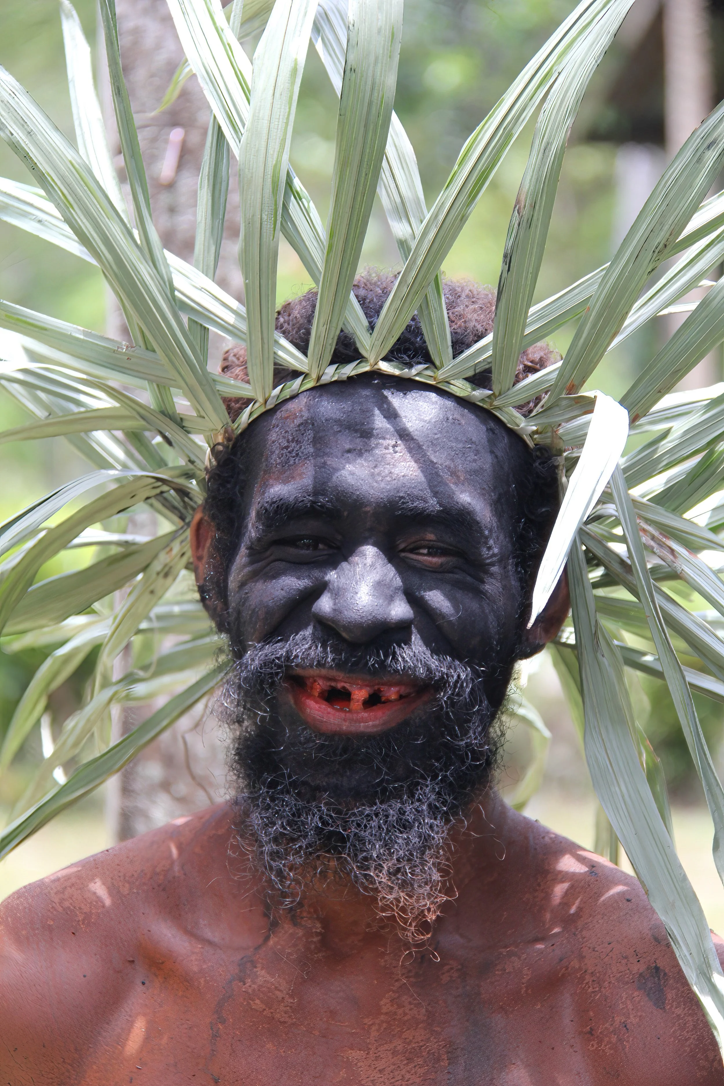 Welcome man at remote Waifoi village, Majalabut Bay, Raja Ampat Regency, SW Papua, Indonesia.