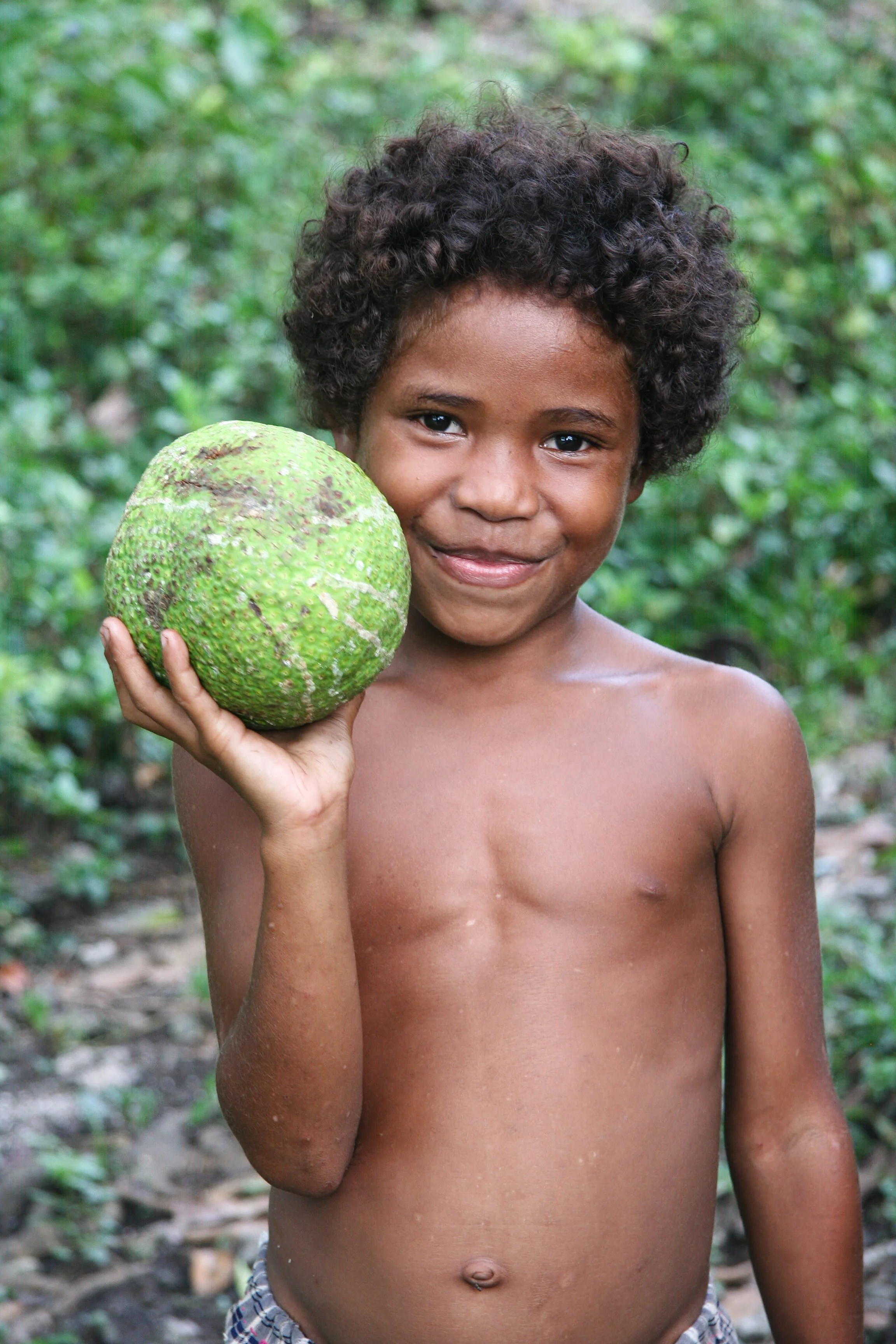 Local boy at Ebola Island, Louisiade Archipelago, Milne Bay Province, Papua New Guinea.