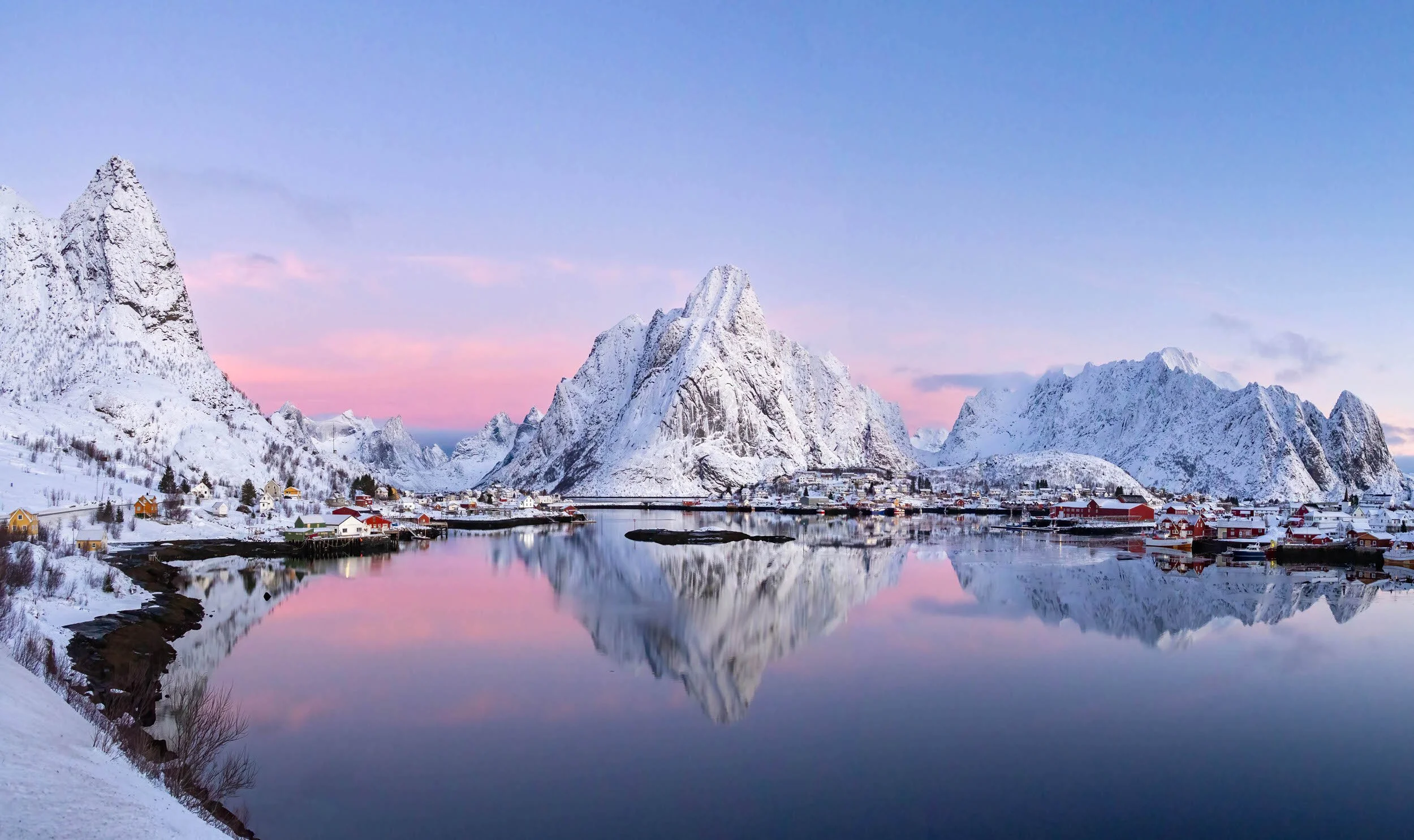 Winter Sunrise over Reine Harbour in the Lofoten Islands, Norway.