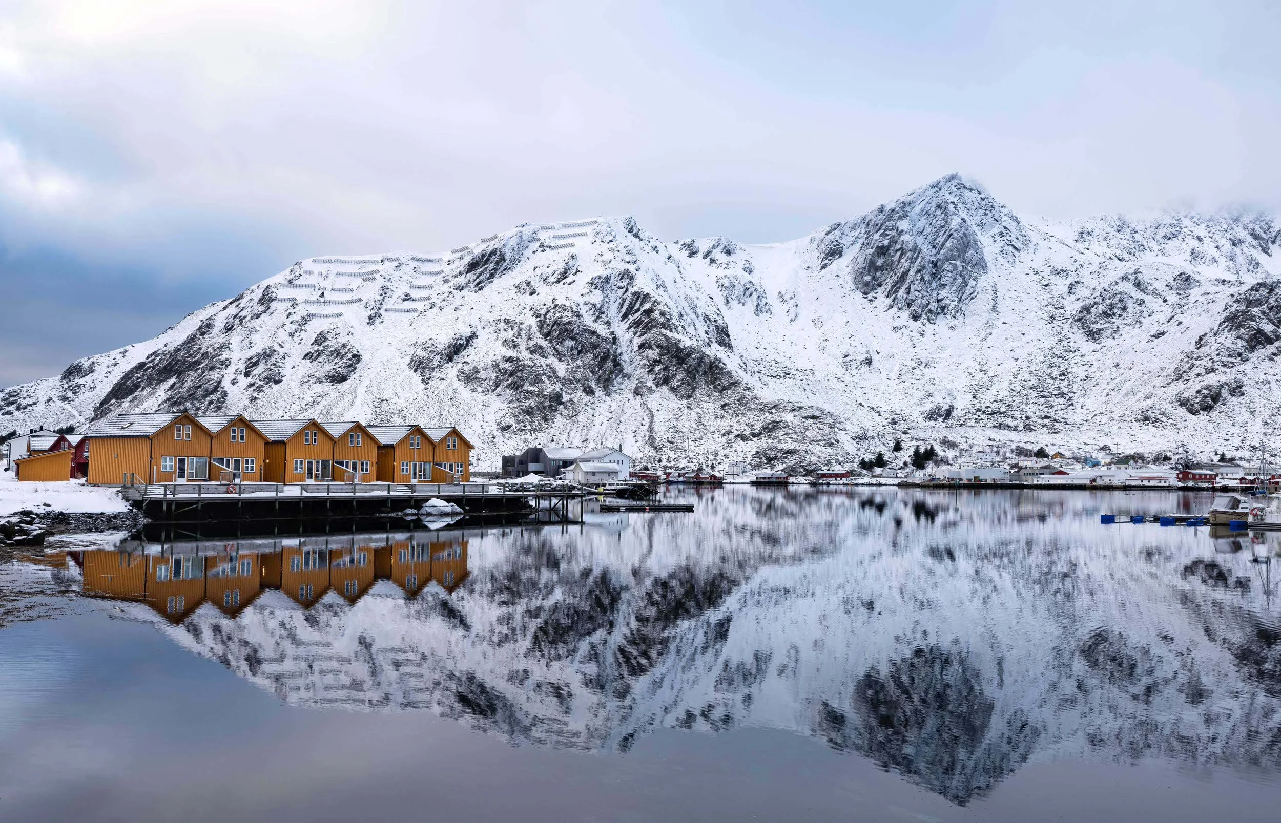Reflections & old fishermen cabins at Ballstadoya, Lofoten Islands, Norway.