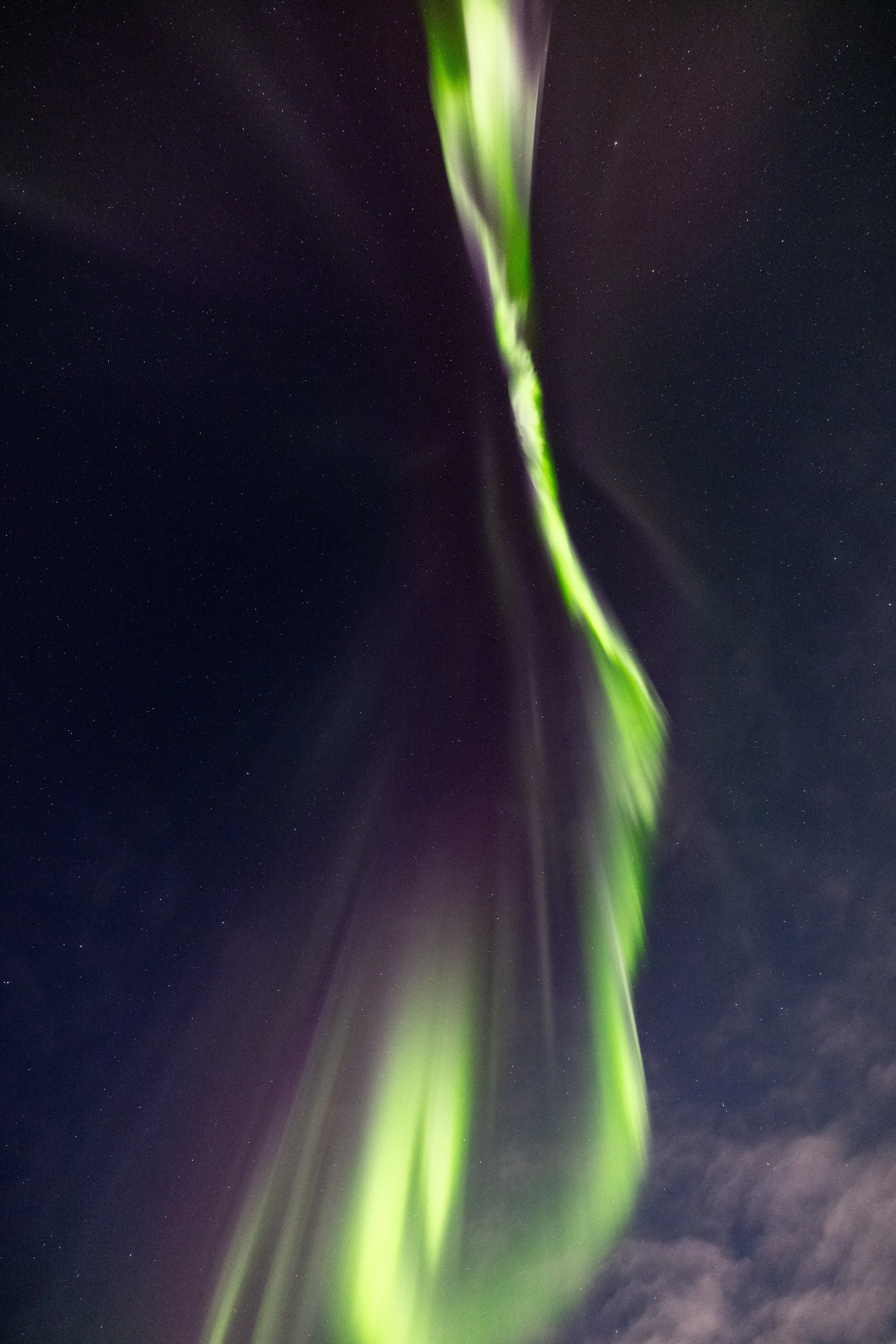 Midwinter Northern Lights above Reine, Lofoten Islands, Norway.
