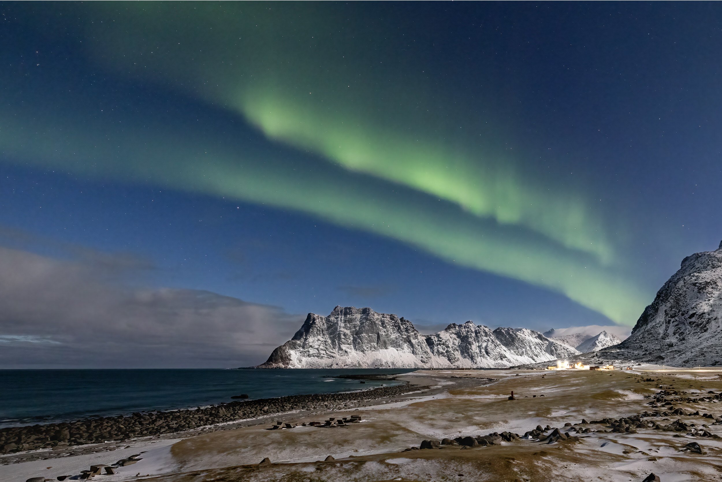 Midwinter Northern Lights above Uttakleiv beach near Vik, Lofoten Islands, Norway.