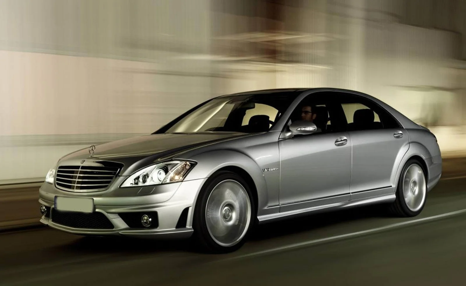 Taxi in Makry Gialos & Ierapetra - Silver Mercedes-Benz luxury sedan driving through an indoor tunnel