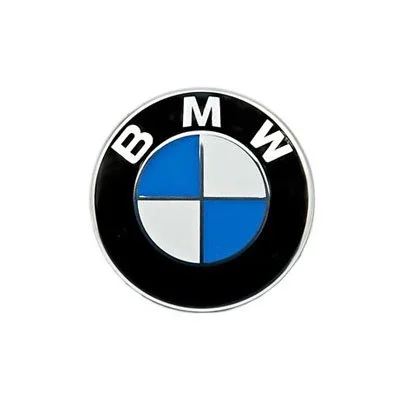 Close-up of the BMW logo with black background, featuring a blue and white circular emblem.