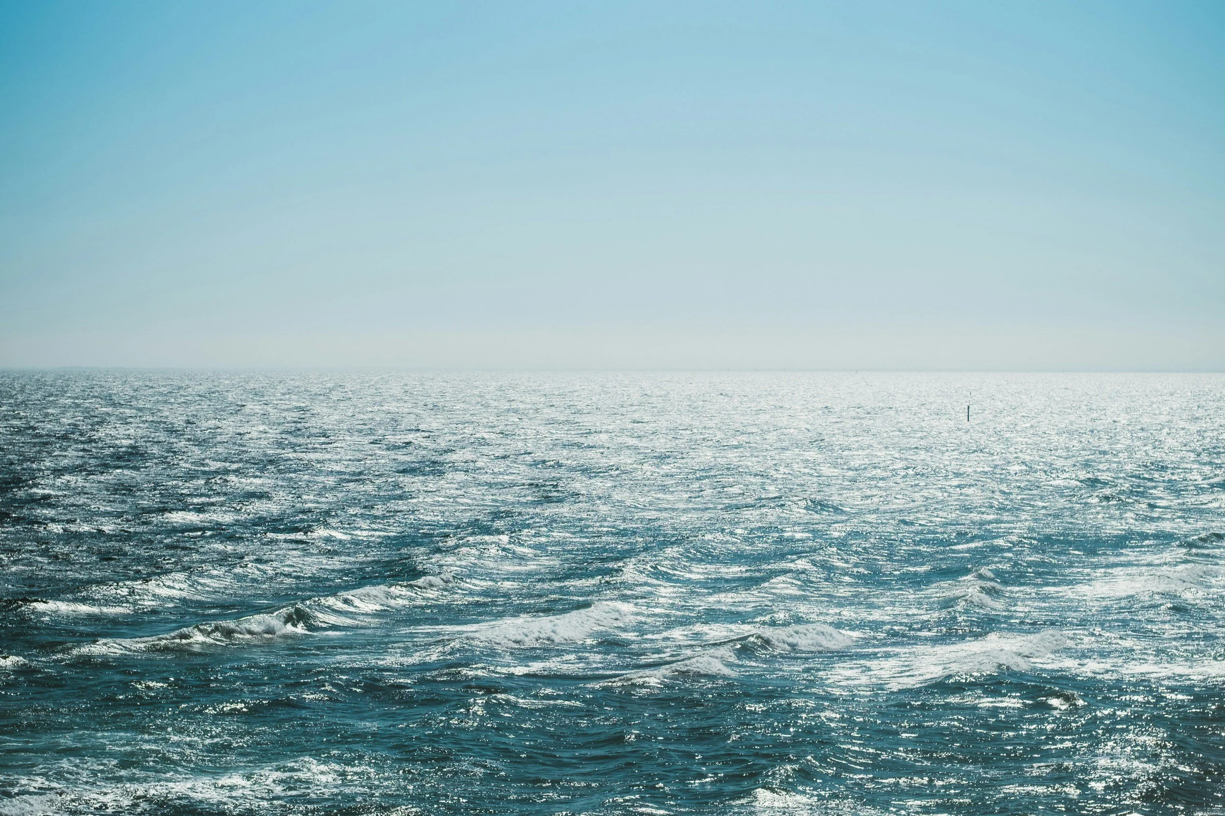 Deep blue ocean currents representing the different signals shaping AI search visibility.