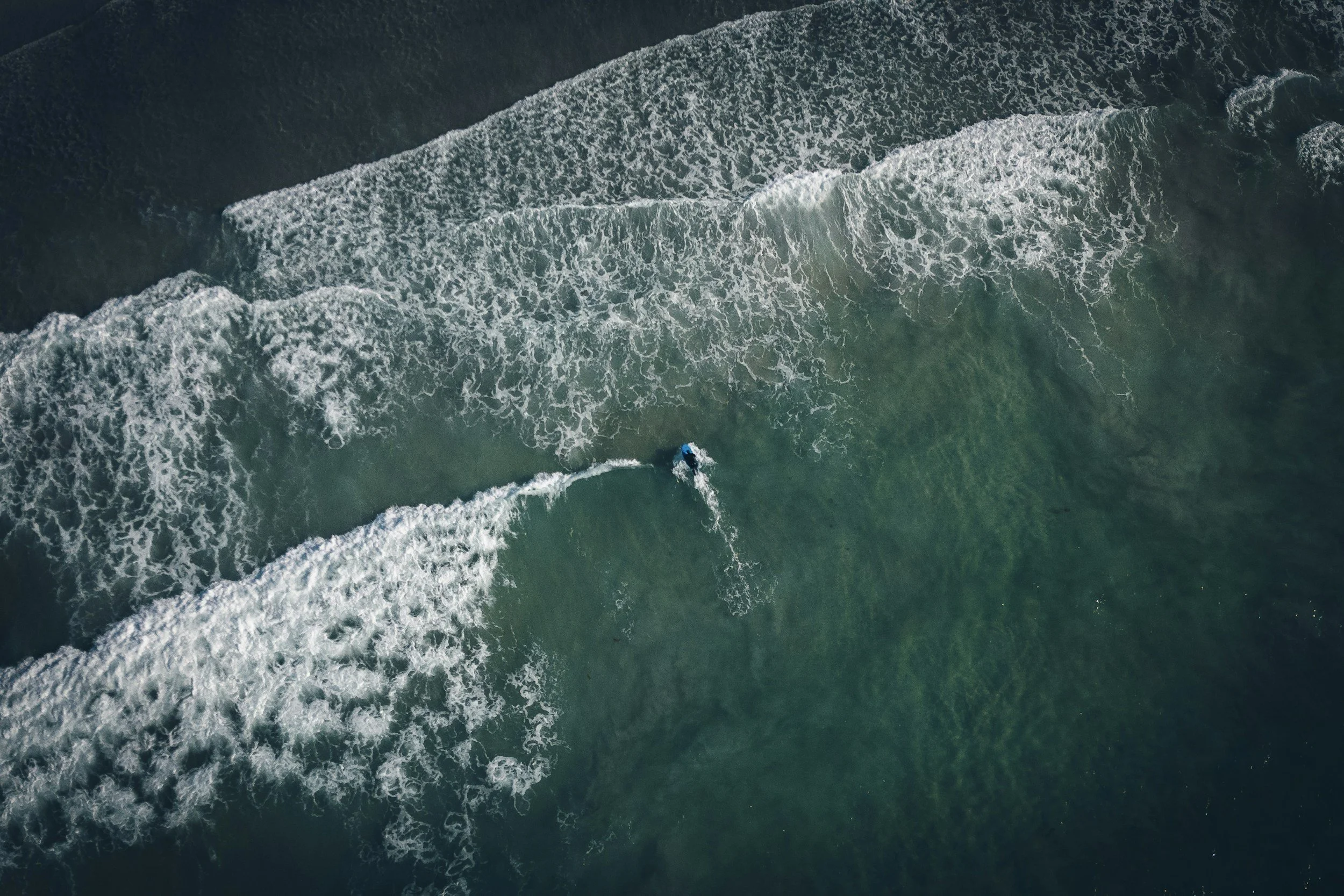 Two deep blue ocean currents representing Google rankings and AI-generated recommendations.