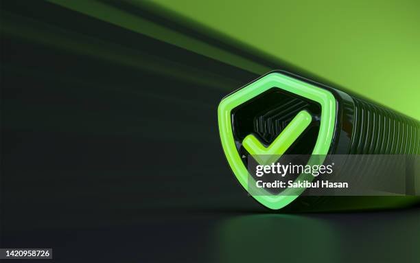 Man looking at laptop with security shield on screen