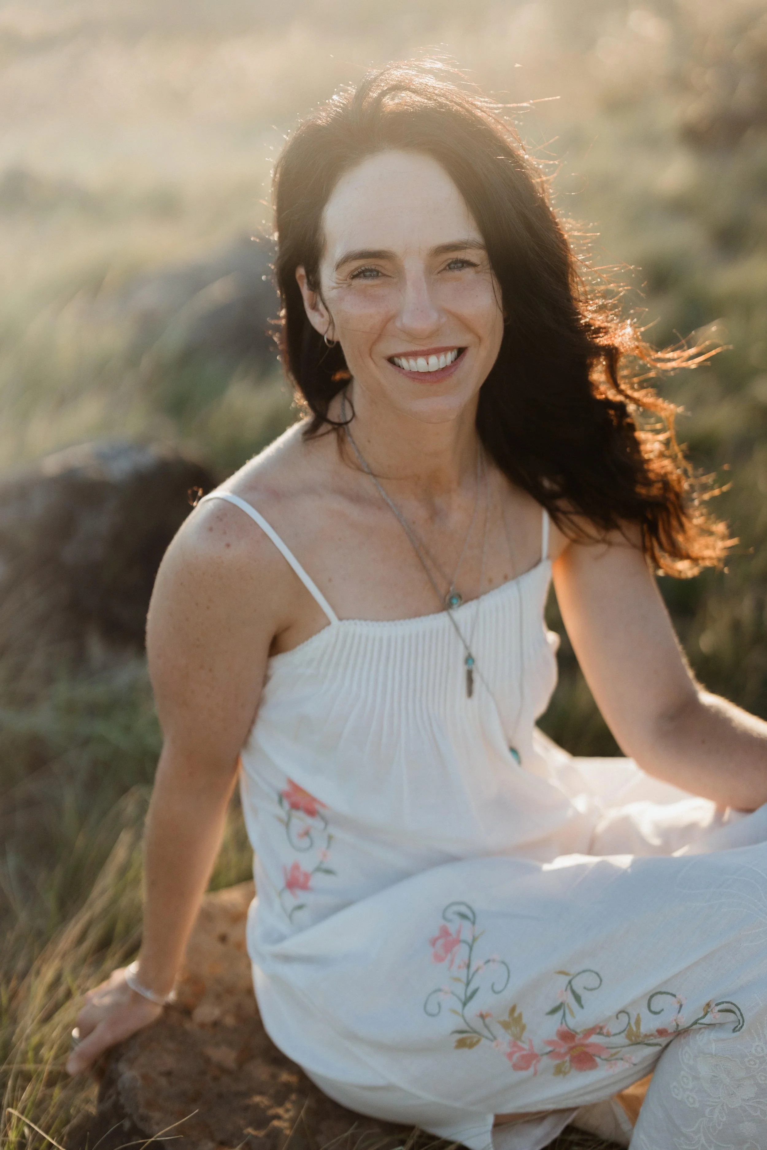 Jenna Chia, holistic kinesiology and complementary therapy practitioner, Seddon Melbourne — warm portrait in natural sunlit setting. Photo by Amy Oliver.