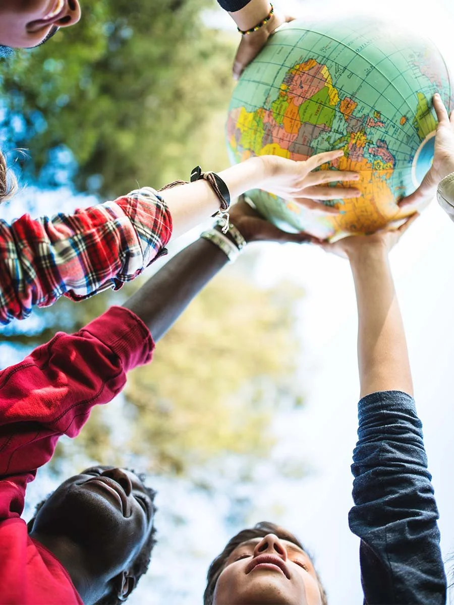 Caribbean students holding the world in their hands.
