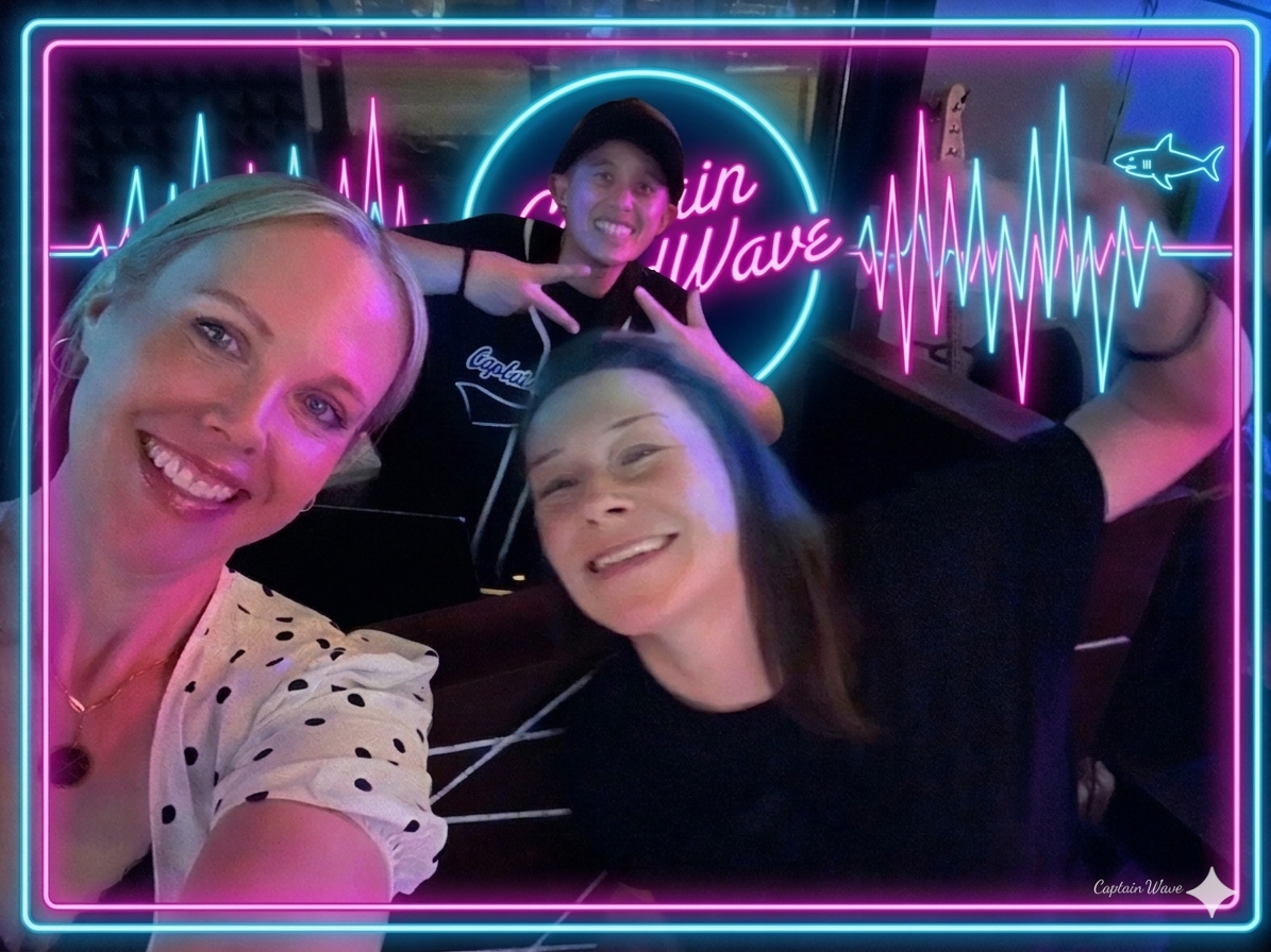 A selfie of DJ Captain SoundWave with supporters at a 50th birthday party at One20, featuring background visuals of edgy neon blue and neon pink soundwaves.