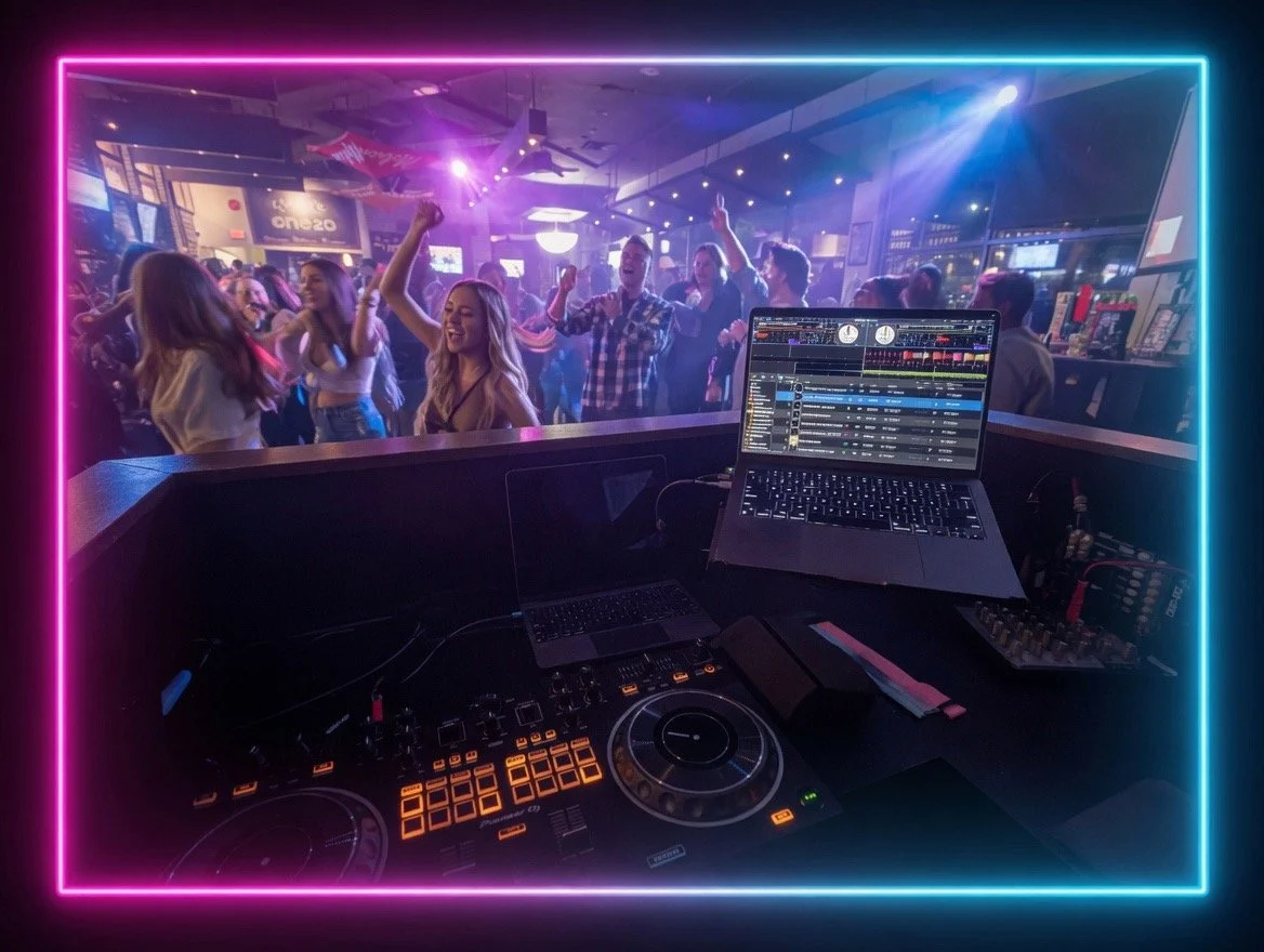 POV from the Captan SoundWave DJ booth at One20 in Surrey, showing the DJ deck, laptop, and a packed dance floor under neon party lights.