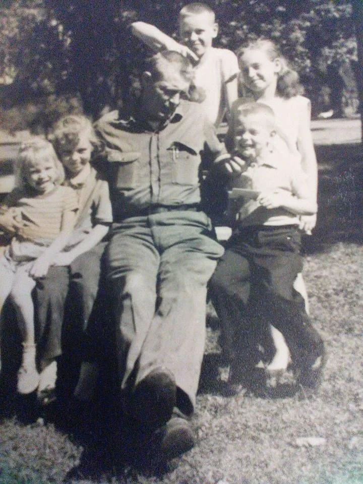 Judy with her dad and siblings