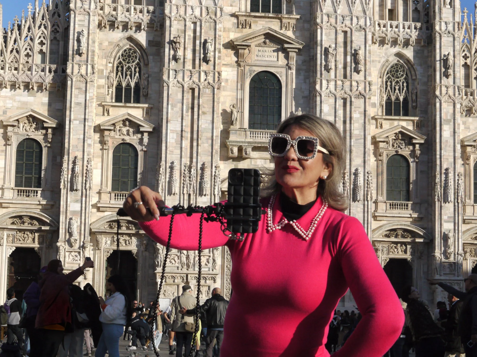 Bob Watkins P1010108  Milan Italy Nov 2023  Woman in pink selfie with Milan Cathedral .jpg